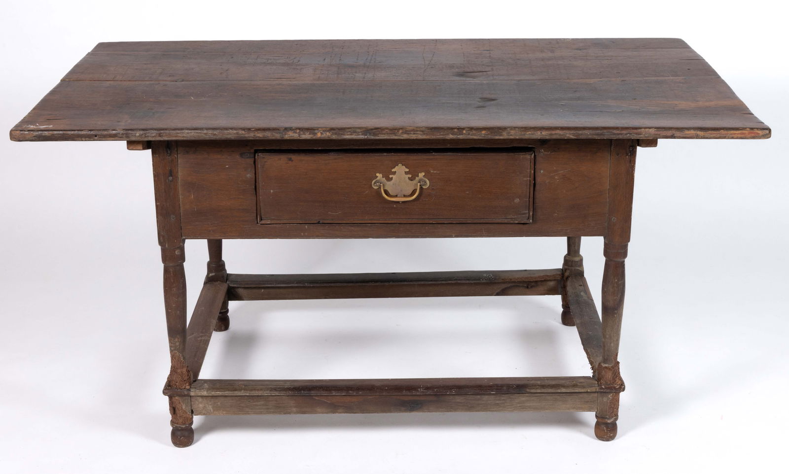 MID-ATLANTIC WALNUT TAVERN TABLE: MID-ATLANTIC WALNUT TAVERN TABLE, the detachable/separate two-board rectangular top, with battens attached to the underside, over a plain apron with one side having a central drawer with replaced