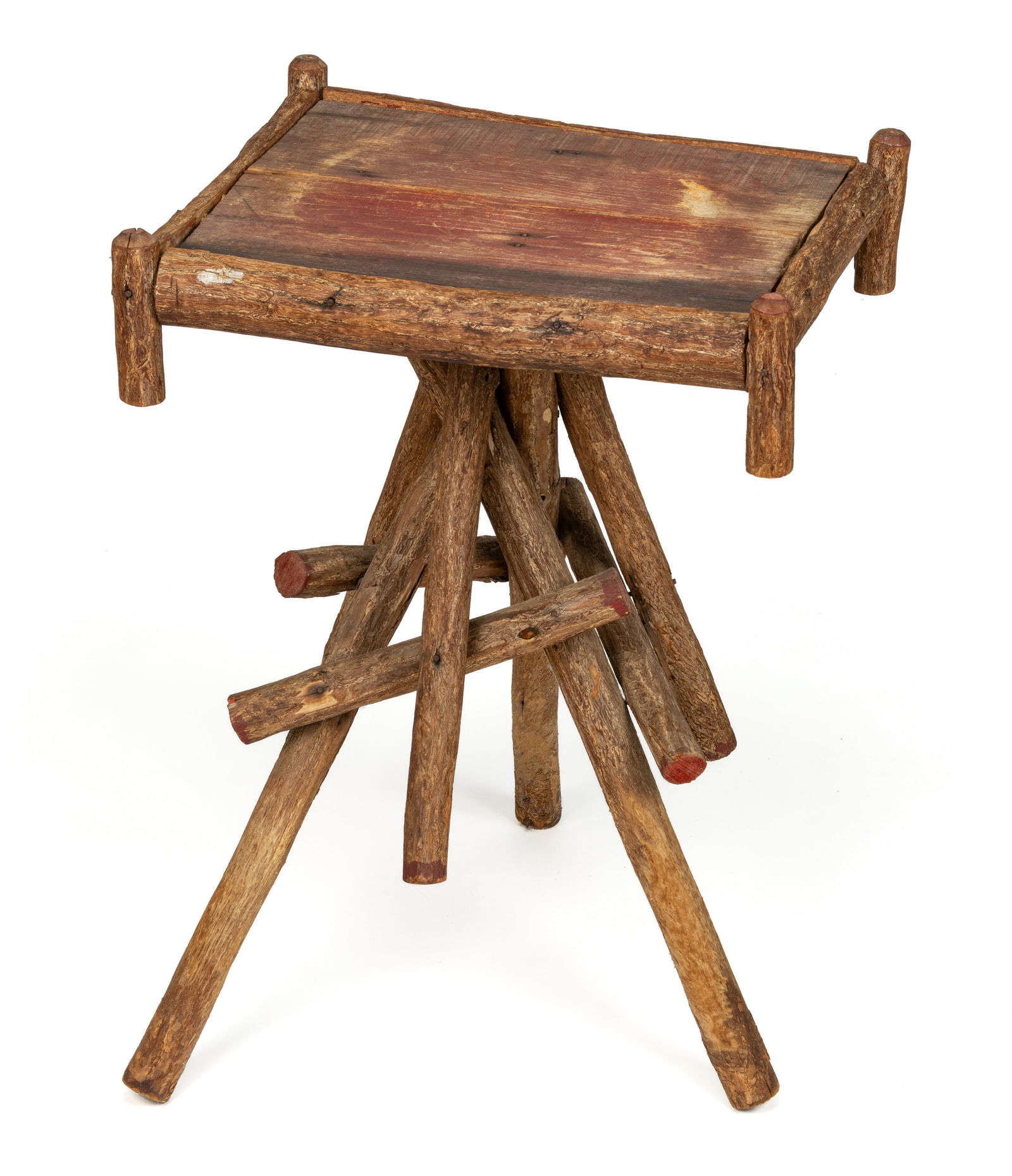 AMERICAN ADIRONDACK-STYLE DIMINUTIVE TWIG STAND / TABLE: AMERICAN ADIRONDACK-STYLE DIMINUTIVE TWIG STAND / TABLE, the rectangular single-board top with applied half-round branches on the edges, supported by a series of crossing legs and braces. First half