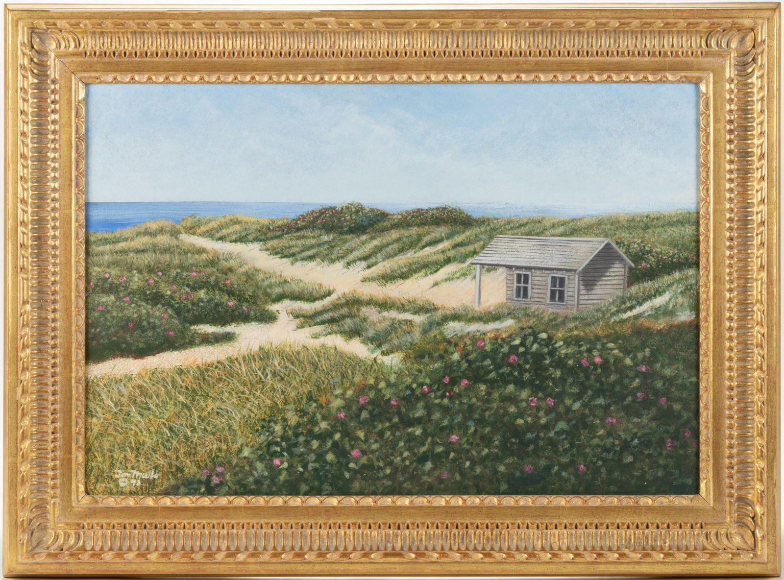 TOM MIELKO (AMERICAN, ACTIVE 20TH / 21ST CENTURY) COASTAL LANDSCAPE PAINTING: TOM MIELKO (AMERICAN, ACTIVE 20TH / 21ST CENTURY) COASTAL LANDSCAPE PAINTING, oil on board, depicting grassy sand dunes with patches of wildflowers surrounding a small structure, the ocean can be seen