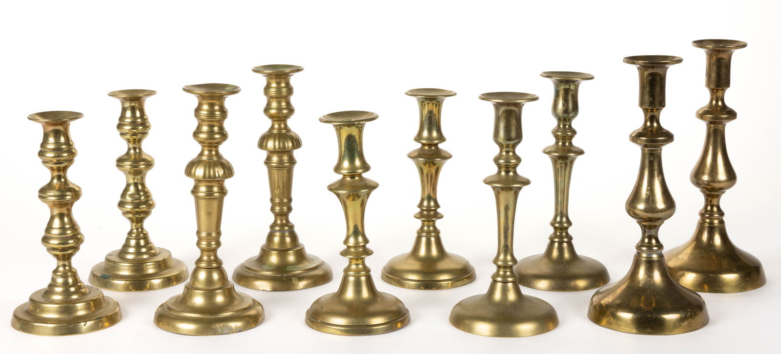 ASSORTED ENGLISH / CONTINENTAL BRASS PUSH-UP CANDLESTICKS, LOT OF FIVE PAIR (1 of 3)