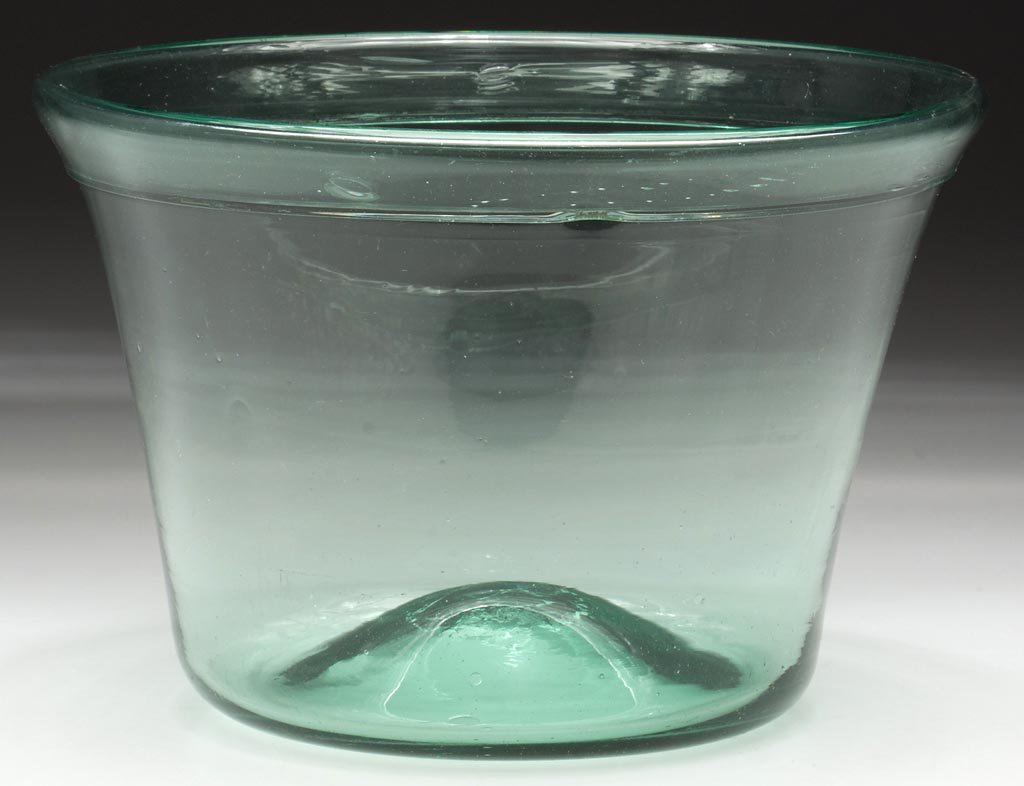FREE-BLOWN DEEP PAN: FREE-BLOWN DEEP PAN, light green, truncated conical form with bold folded rim, kick-up base with rough pontil mark. Probably Pittsburgh area. 1800-1850. 6" H, 9" D. Literature: Innes - Pittsburgh Glas