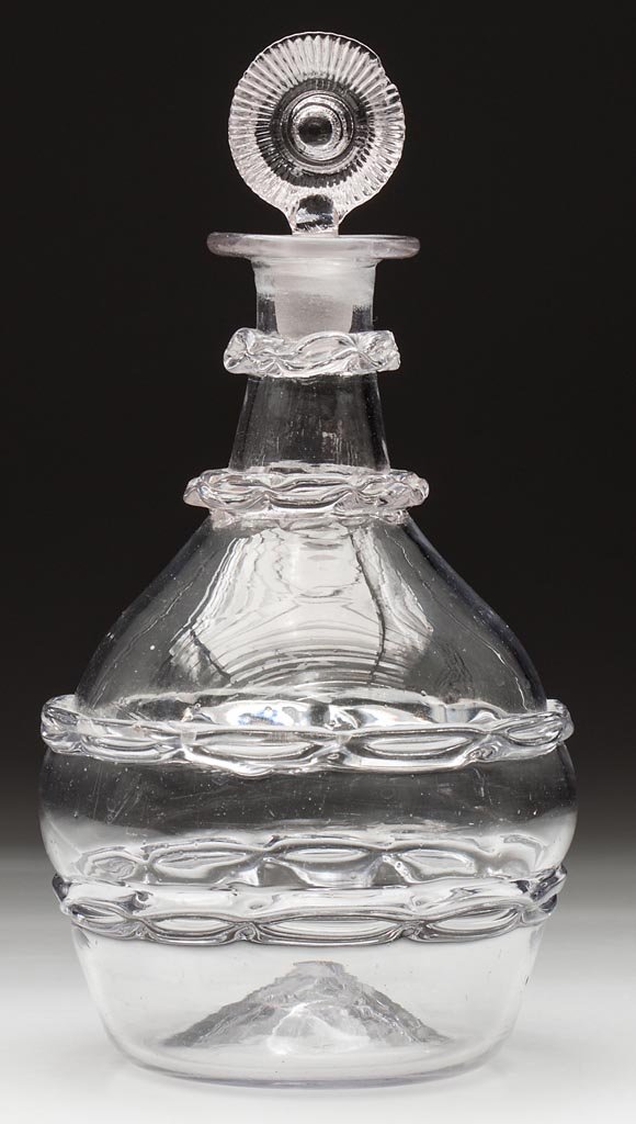 FREE-BLOWN THOMAS CAINS CHAIN-DECORATED QUART DECANTER: FREE-BLOWN THOMAS CAINS CHAIN-DECORATED QUART DECANTER, colorless with a slight gray cast, Prussian form with two pinched-chain bands on body and two additional on neck, flanged mouth, rough pontil ma