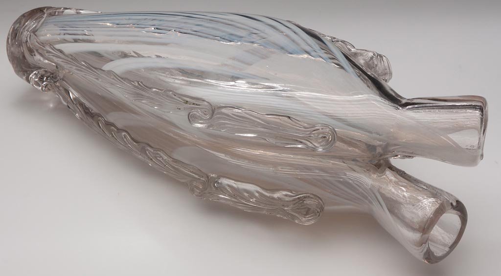 FREE-BLOWN MARBRIE-LOOP-DECORATED GEMEL BOTTLE: FREE-BLOWN MARBRIE-LOOP-DECORATED GEMEL BOTTLE, colorless with opal loopings, flattened ovoid form with opposing necks and plain mouths, applied feathered rigaree to sides of both bottles, rough ponti
