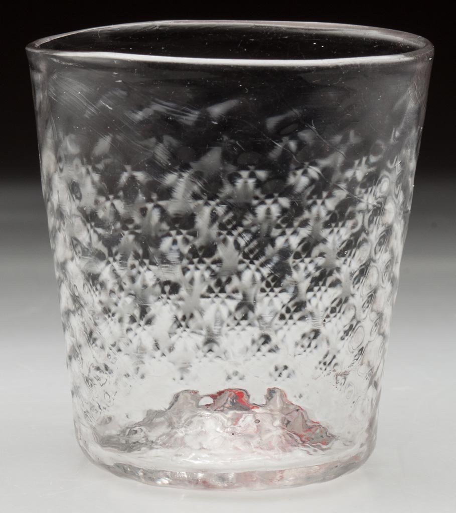 PATTERN-MOLDED DIMINUTIVE TUMBLER: PATTERN-MOLDED DIMINUTIVE TUMBLER, colorless, tapered form with rows of 21 small diamonds that continue onto the base, rough pontil mark. 18th or 19th century. 2 3/8" H, 2 1/4" D rim, 1 3/4" D base. P