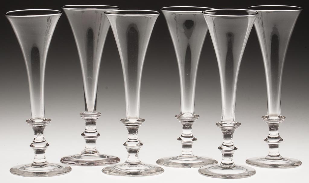 FREE-BLOWN FLUTES, SET OF SIX: FREE-BLOWN FLUTES, SET OF SIX, colorless lead glass, each deep conical bowl raised on a sharp-knop stem and circular foot with polished pontil mark. 19th century. 6 3/4" H. Provenance: From a North Ca