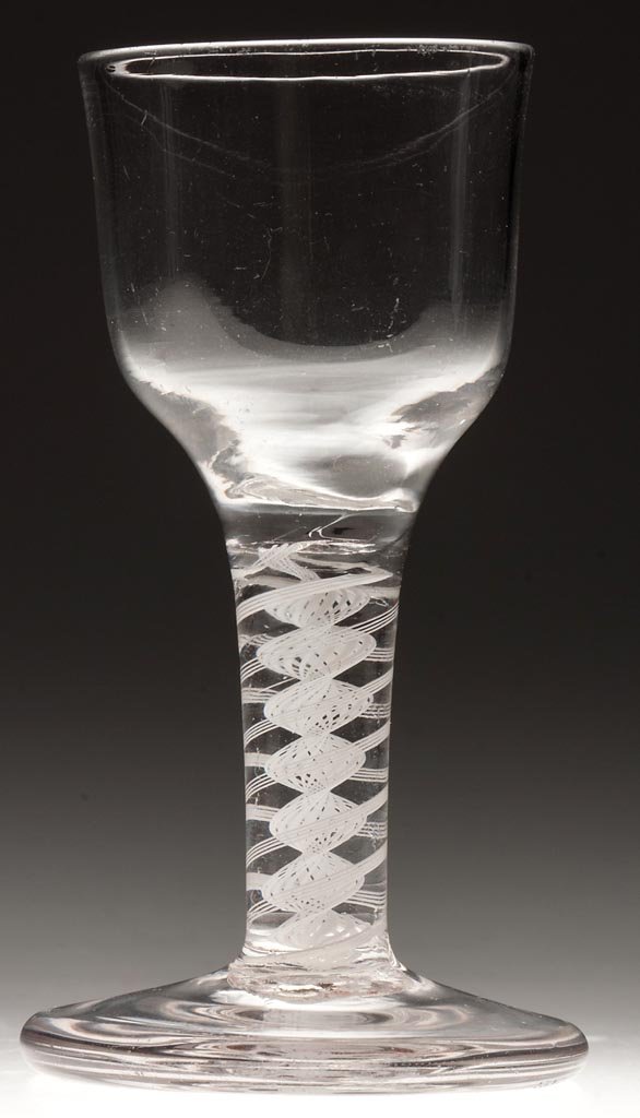 FREE-BLOWN OPAQUE-TWIST STEM WINE GLASS: FREE-BLOWN OPAQUE-TWIST STEM WINE GLASS, colorless lead glass, ogee bowl raised on a stem containing a pair of four-ply spiral bands outside lace twist, thick, slightly conical foot with a rough ponti