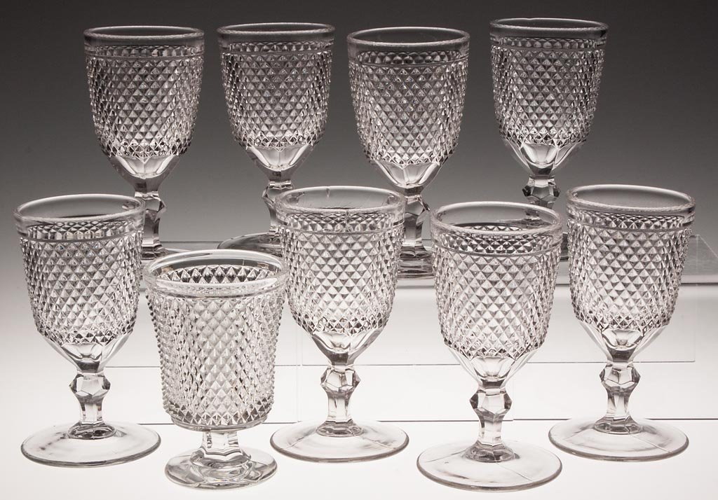 DIAMOND POINT GOBLETS, LOT OF EIGHT: DIAMOND POINT GOBLETS, LOT OF EIGHT, colorless lead glass, each with polished pontil mark and unusually broad foot. Together with a spooner. Ten pieces total. Third quarter 19th century. 5 3/8" to 6 1