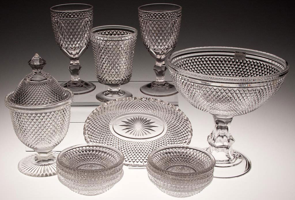 DIAMOND POINT TABLE ARTICLES, LOT OF 14: DIAMOND POINT TABLE ARTICLES, LOT OF 14, colorless lead glass, comprising eight sauce dishes, two goblets, a covered sugar bowl, open compote, oval dish and spooner. Third quarter 19th century. 1 1/8"