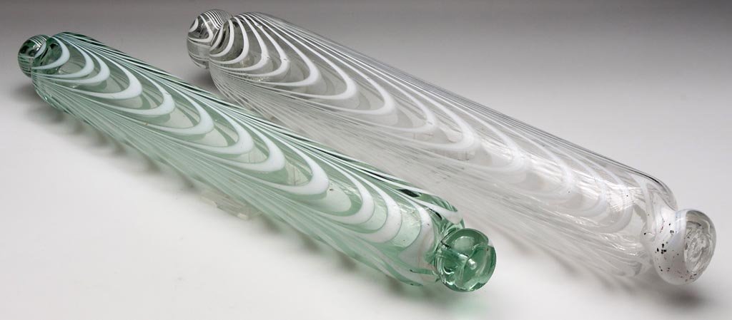 Free-Blown Marbrie-Loop-Decorated Rolling Pins, Lot Of: FREE-BLOWN MARBRIE-LOOP-DECORATED ROLLING PINS, LOT OF TWO, colorless and light green, each with four groups of opal loopings and knob handles with rough pontil marks. 1850-1880. 15" and 15 1/2" L. Pr