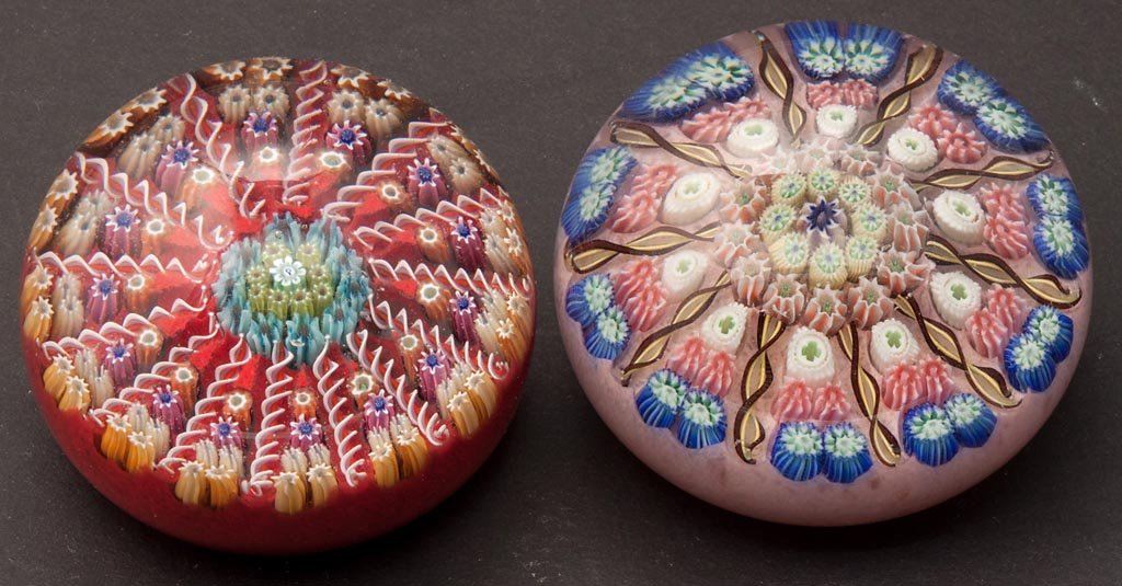 PERTHSHIRE MILLEFIORI PAPERWEIGHTS, LOT OF TWO: PERTHSHIRE MILLEFIORI PAPERWEIGHTS, LOT OF TWO, each laid out in a spoke pattern, one with "P" cane and label, other unsigned. Scotland. Second half 20th century. 2 3/8" and 2 1/2" D. Provenance: From