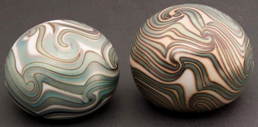 CHARLES LOTTON STUDIO ART GLASS PAPERWEIGHTS, LOT OF TW: CHARLES LOTTON STUDIO ART GLASS PAPERWEIGHTS, LOT OF TWO, iridescent surfaces with King Tut-style decoration, each signed "Lotton 1972" around the ground pontil mark. Dated 1972. 2 7/8" and 3" D.Prove