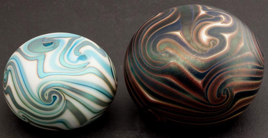 CHARLES LOTTON STUDIO ART GLASS PAPERWEIGHTS, LOT OF TW: CHARLES LOTTON STUDIO ART GLASS PAPERWEIGHTS, LOT OF TWO, iridescent surfaces with King Tut-style decoration, each signed "Lotton 1972" around the ground pontil mark. Dated 1972. 2 1/2" and 3" D.Prove