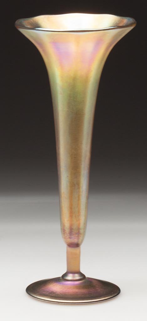 TIFFANY FAVRILE RIB-OPTIC VASE: TIFFANY FAVRILE RIB-OPTIC VASE, gold iridescent, trumpet form molded with ten ribs, raised on a short stem and circular foot, signed "L. C. Tiffany - Favrile 483P" within the polished pontil mark. Lou