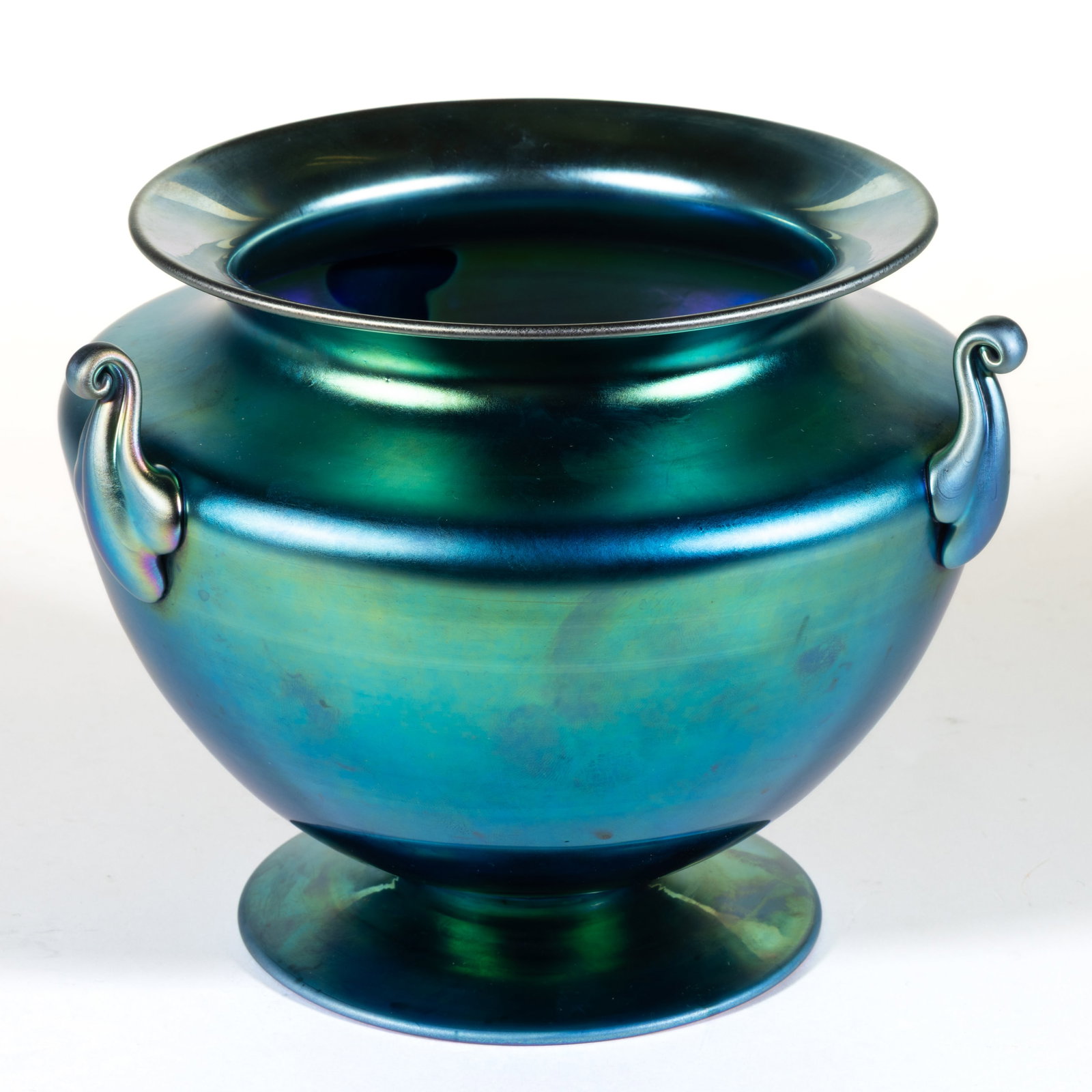 STEUBEN AURENE BLUE IRIDESCENT THREE-HANDLED ART GLASS VASE: STEUBEN AURENE BLUE IRIDESCENT THREE-HANDLED ART GLASS VASE, Blue Aurene, shape 6627, urn-form with flaring rim and three applied handles, signed to the underside, "STEUBEN AURENE 6627&