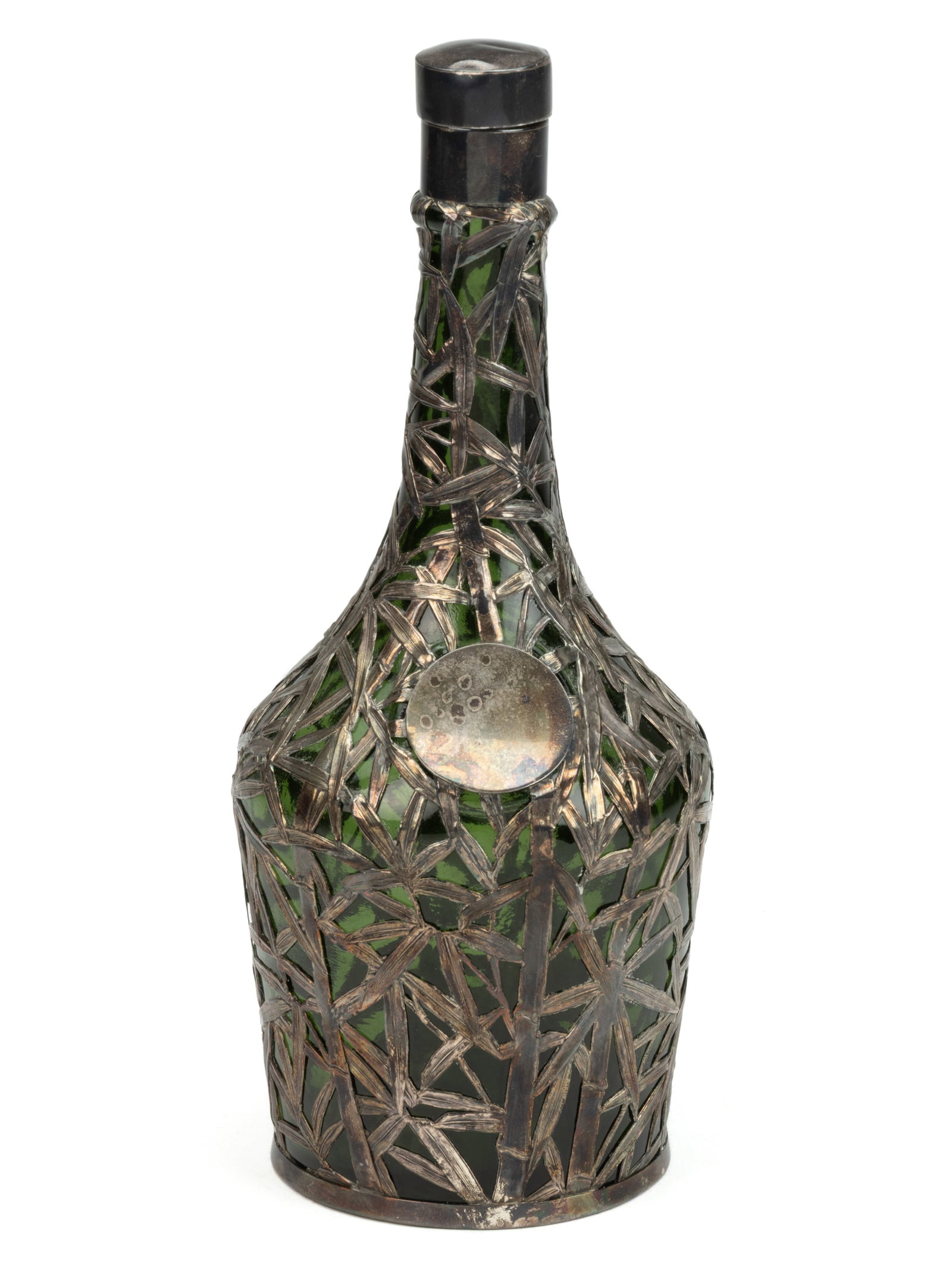 JAPANESE ATTRIBUTED SILVER-OVERLAY GLASS BOTTLE: JAPANESE ATTRIBUTED SILVER-OVERLAY GLASS BOTTLE, olive green, Bamboo leaf and branch design with circular cartouche and removable silver mount stopper. Silver of unknown finen
