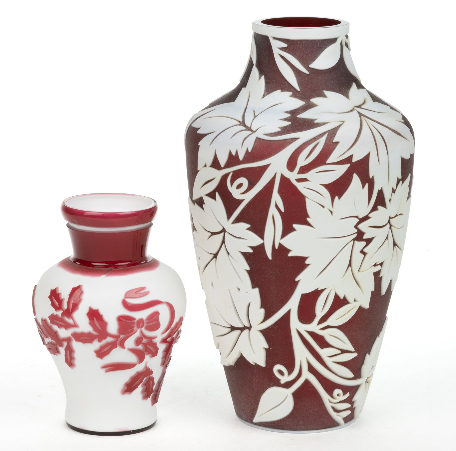 KELSEY MURPHY / PILGRIM SAND-CARVED CAMEO ART GLASS VASES, LOT OF TWO: KELSEY MURPHY / PILGRIM SAND-CARVED CAMEO ART GLASS VASES, LOT OF TWO, each urn form, comprising a white to burgundy decorated with Maple Leaves and a cranberry to white decorated with Mistl