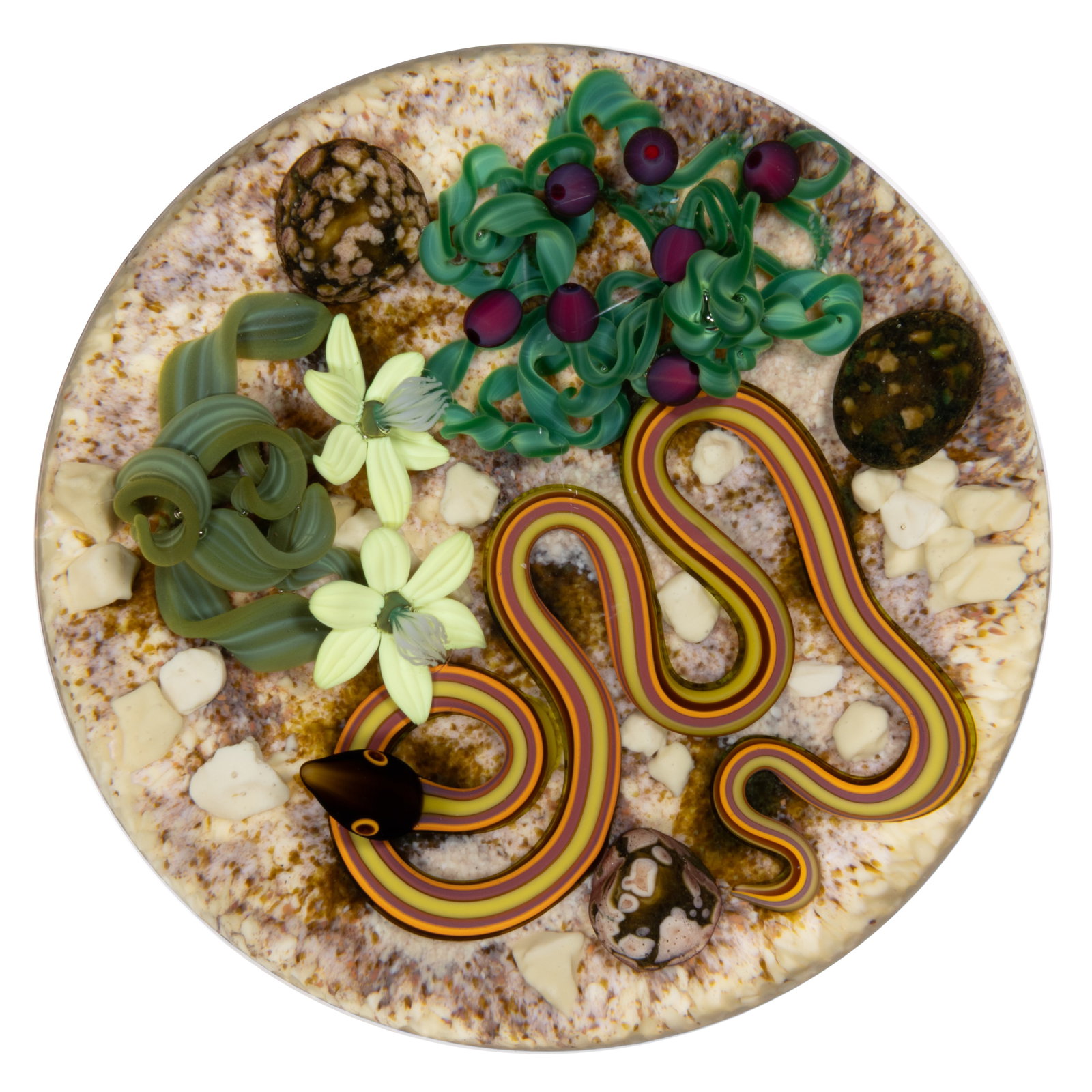 GORDON SMITH (AMERICAN, B. 1959) SNAKE IN THE DESERT LAMPWORK STUDIO ART GLASS PAPERWEIGHT: GORDON SMITH (AMERICAN, B. 1959) SNAKE IN THE DESERT LAMPWORK STUDIO ART GLASS PAPERWEIGHT, brown, yellow, red, and orange snake coiled on a desert frit ground among several tan or mottled stones, adj