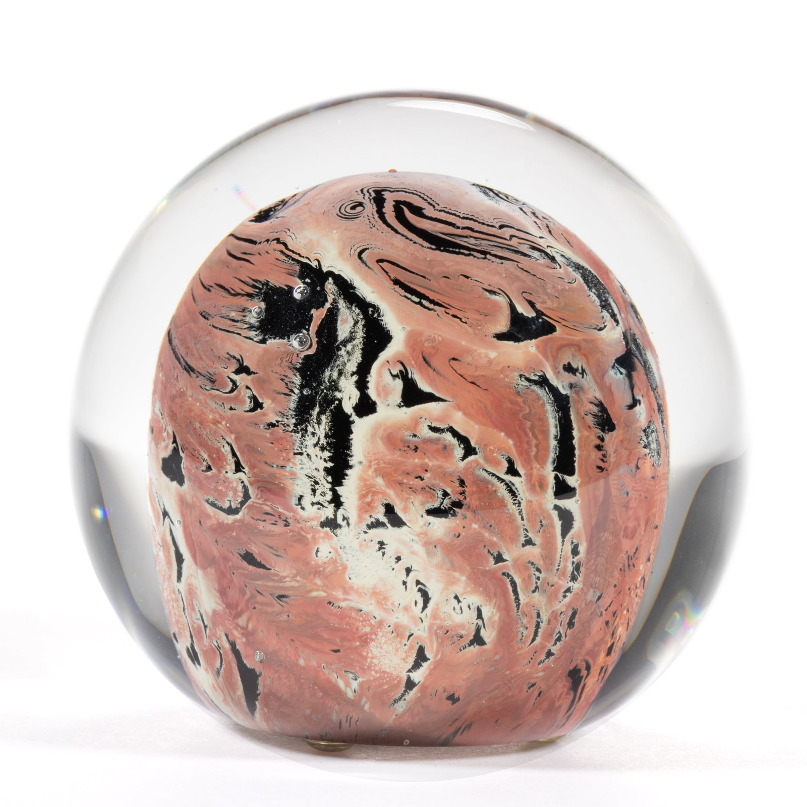 JOSH SIMPSON (AMERICAN, B. 1949) UNUSUAL MOTTLED STUDIO ART GLASS PAPERWEIGHT: JOSH SIMPSON (AMERICAN, B. 1949) UNUSUAL MOTTLED STUDIO ART GLASS PAPERWEIGHT, having a dark interior core with unusual red decoration to the surface, signed to the underside, "Simpson 1989"