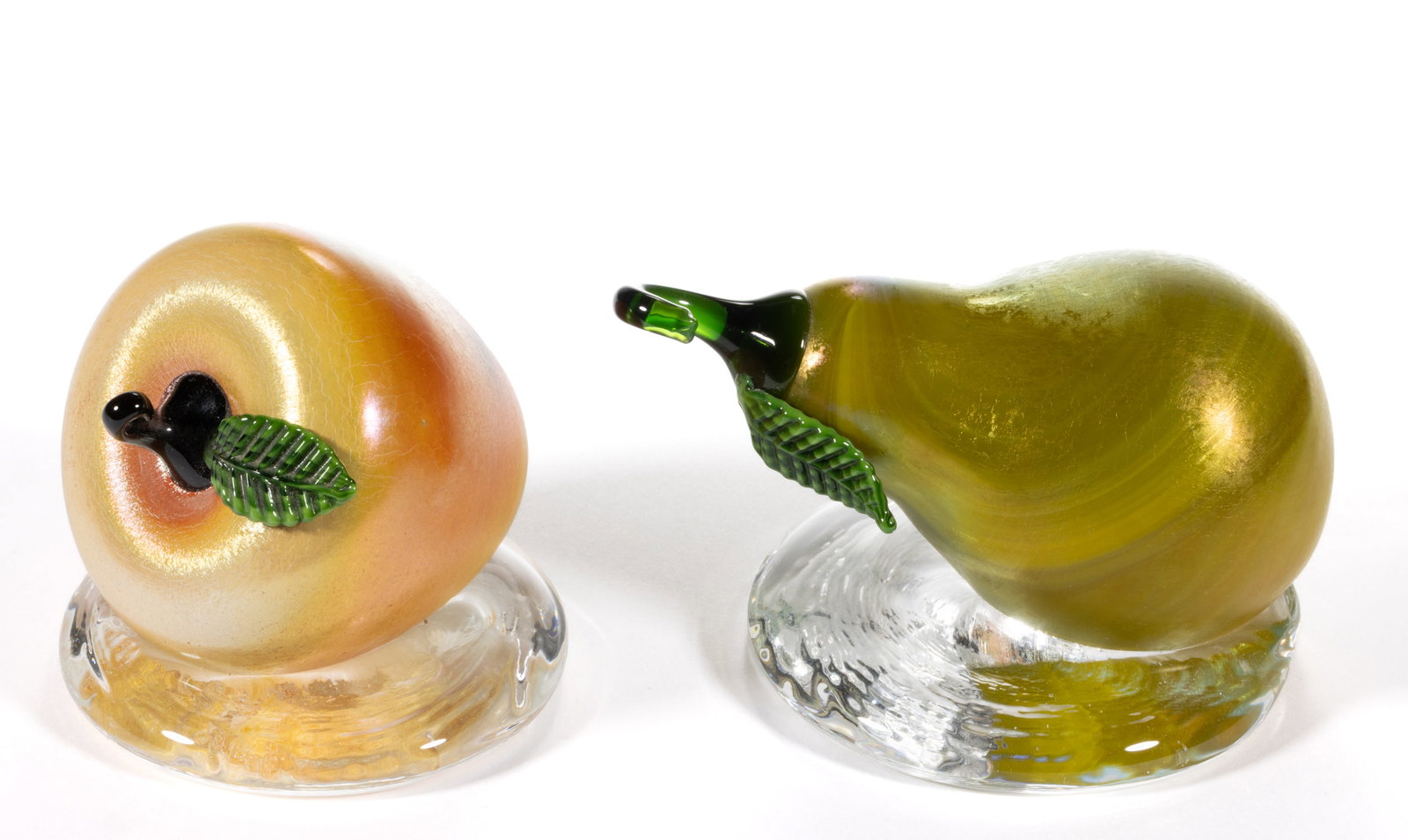 LUNDBERG STUDIOS IRIDESCENT FIGURAL ART GLASS FRUIT PAPERWEIGHTS, LOT OF TWO (1 of 3)