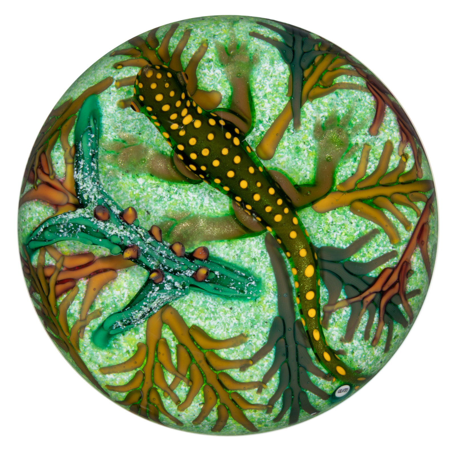 WILLIAM MANSON (SCOTTISH, 1951-2025) LIZARD LAMPWORK STUDIO ART GLASS PAPERWEIGHT: WILLIAM MANSON (SCOTTISH, 1951-2025) LIZARD LAMPWORK STUDIO ART GLASS PAPERWEIGHT, large green and yellow spotted lizard standing among green, tan, and brown foliage with a large green branch above wh