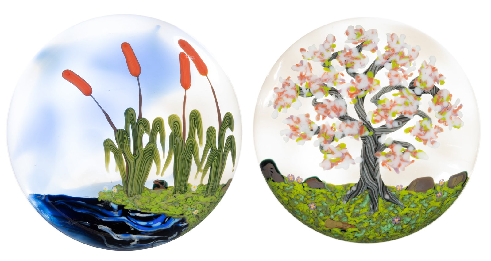 JEFFREY TODD (AMERICAN, 1963-2026) LANDSCAPE LAMPWORK STUDIO ART GLASS PAPERWEIGHTS, LOT OF TWO: JEFFREY TODD (AMERICAN, 1963-2026) LANDSCAPE LAMPWORK STUDIO ART GLASS PAPERWEIGHTS, LOT OF TWO, comprising one featuring four orange cattails sprouting out of wavy green grass blades anchored to a&nb