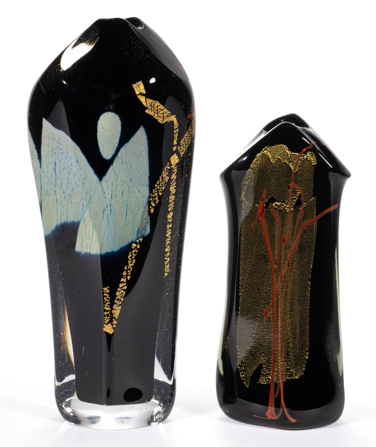 GLASS EYE STUDIOS ABSTRACT ART GLASS PAPERWEIGHT VASES, LOT OF TWO: GLASS EYE STUDIOS ABSTRACT ART GLASS PAPERWEIGHT VASES, LOT OF TWO, each being tall with asymmetrical forms, each having a black ground with aventurine decoration, taller example having blue/platinum