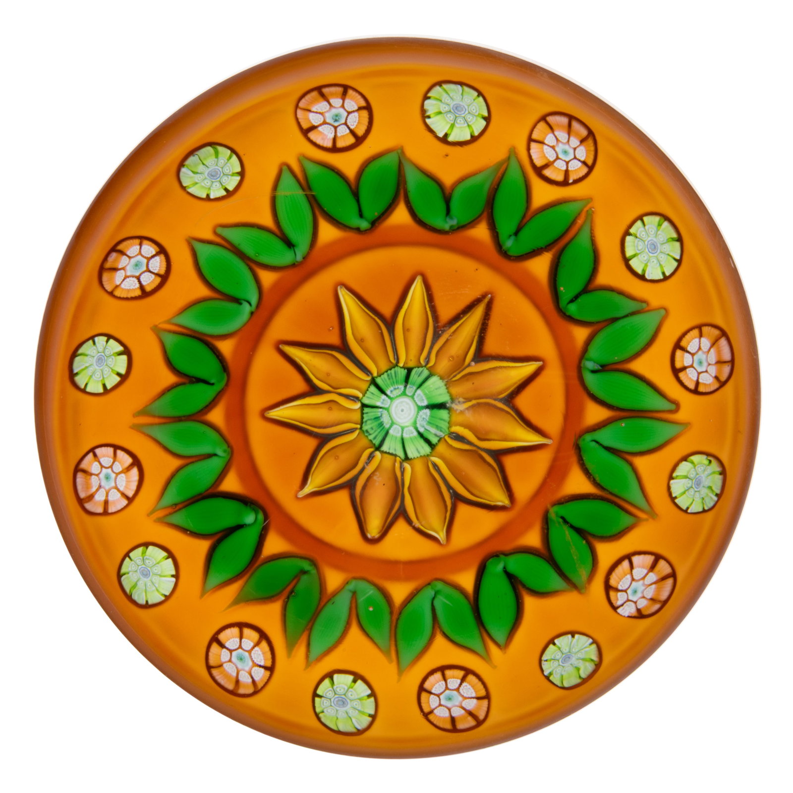 VINTAGE PERTHSHIRE ORANGE FLOWER LAMPWORK ART GLASS PAPERWEIGHT: VINTAGE PERTHSHIRE ORANGE FLOWER LAMPWORK ART GLASS PAPERWEIGHT, central orange flower with a green and white central cane, encircled by paired green leaves with spaced millefiori canes to the exterio