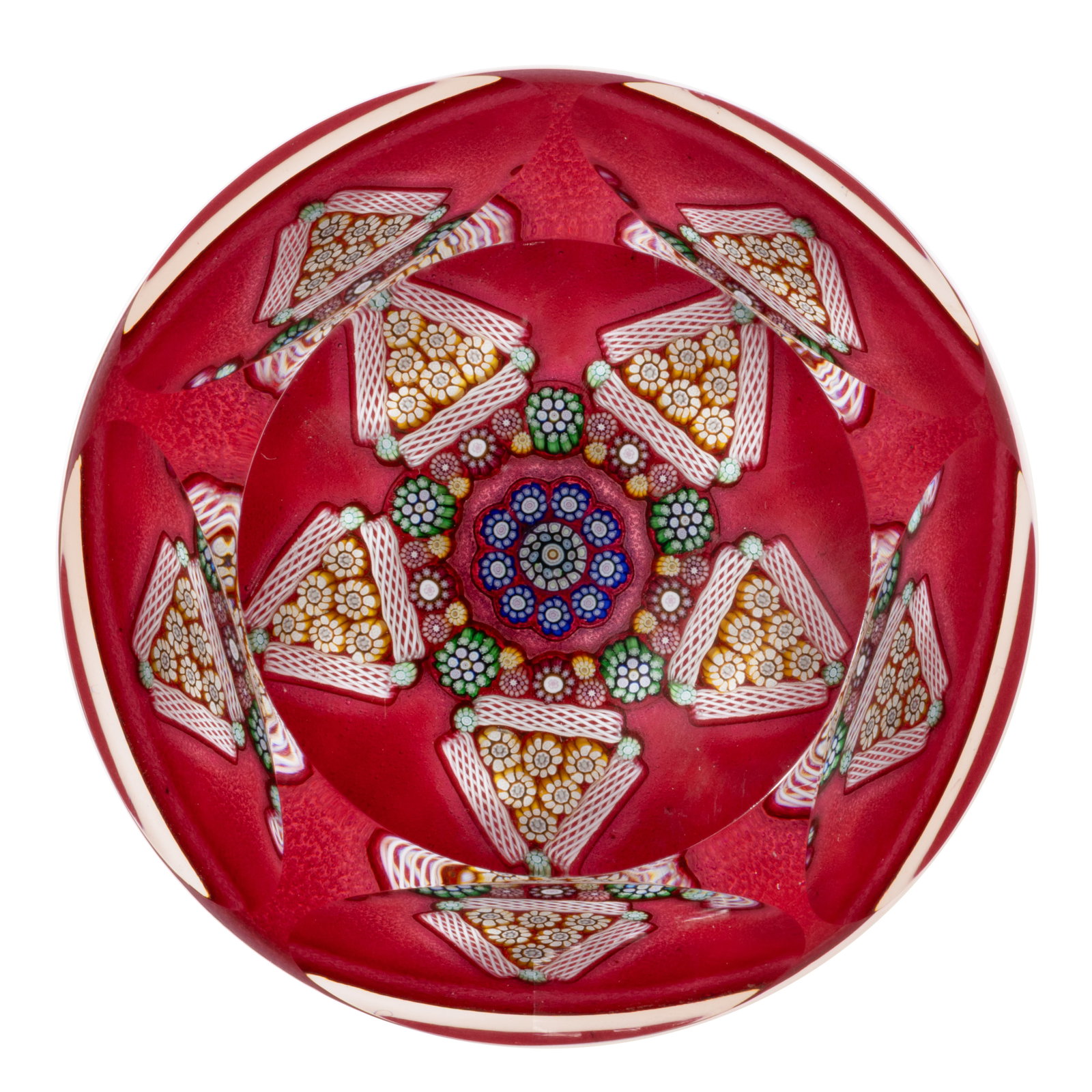 VINTAGE PERTHSHIRE STAR MILLEFIORI ART GLASS PAPERWEIGHT: VINTAGE PERTHSHIRE STAR MILLEFIORI ART GLASS PAPERWEIGHT, cut faceted with a circular top window, central blue and white complex canes, encircled by an interior garland of complex canes in a vari