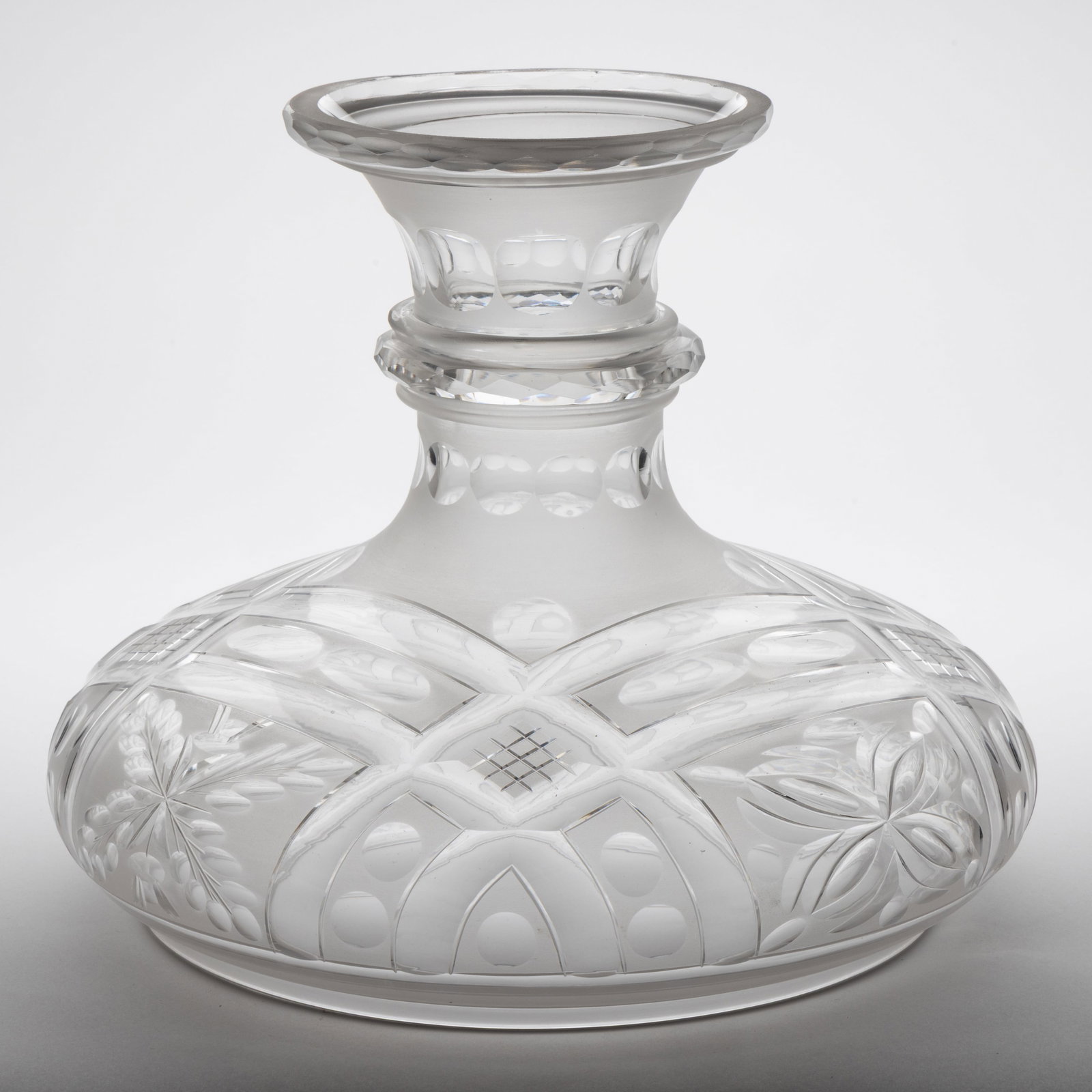 FREE-BLOWN AND CUT SINUMBRA LAMP SHADE: FREE-BLOWN AND CUT SINUMBRA LAMP SHADE, colorless with frosted finish, umbrella form, cut stylized geometrical patterns including cross-bars, cross-hatching, punties, ovals, and floral petals,&nb