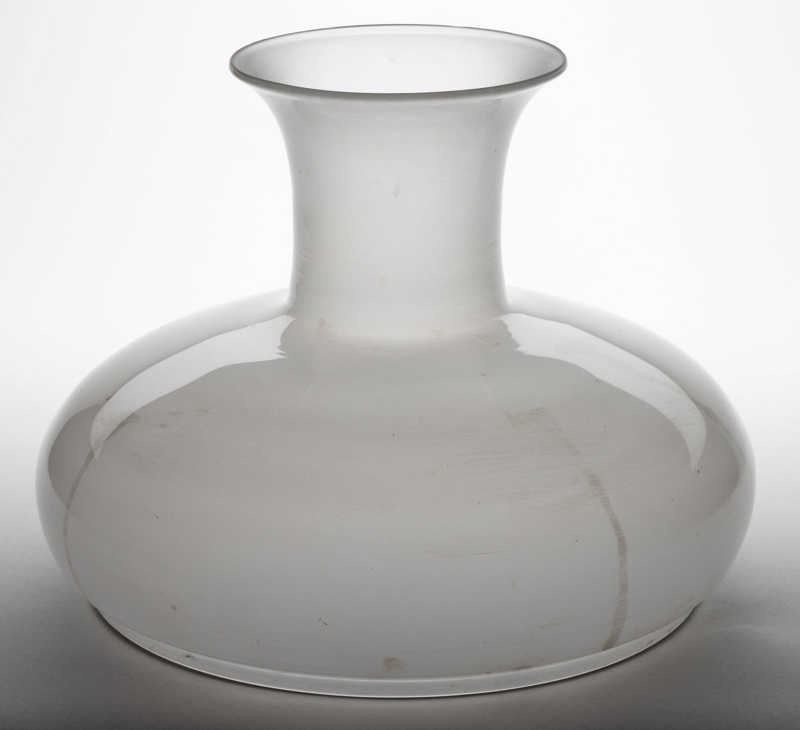 FREE-BLOWN SINUMBRA LAMP SHADE: FREE-BLOWN SINUMBRA LAMP SHADE, colorless with frosted finish to the interior, umbrella form. Second quarter 19th century. 9 3/4" H, 11 1/2" D fitter, 6" D top rim.