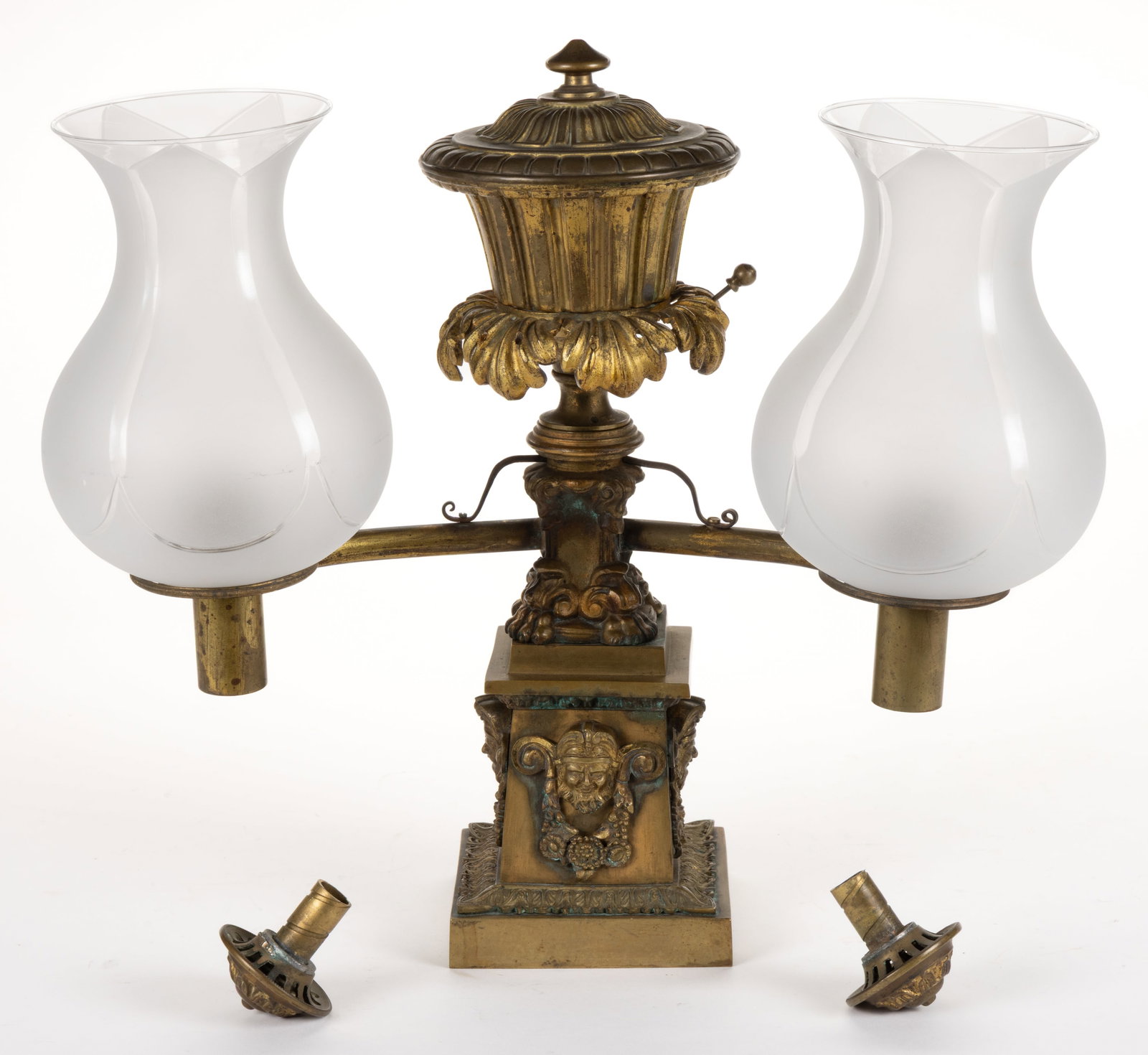 GILTED BRONZE / BRASS DOUBLE- ARM ARGAND LAMP: GILTED BRONZE / BRASS DOUBLE-ARM ARGAND LAMP, urn-form reservoir with ribbing and over a prism ring with dropped acanthus leaf ornamentation, stylized columnar stem with scrolls an