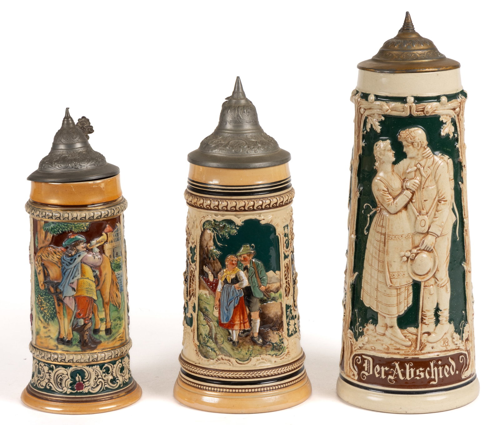 GERMAN RELIEF-DECORATED CERAMIC STEINS, LOT OF THREE (1 of 4)
