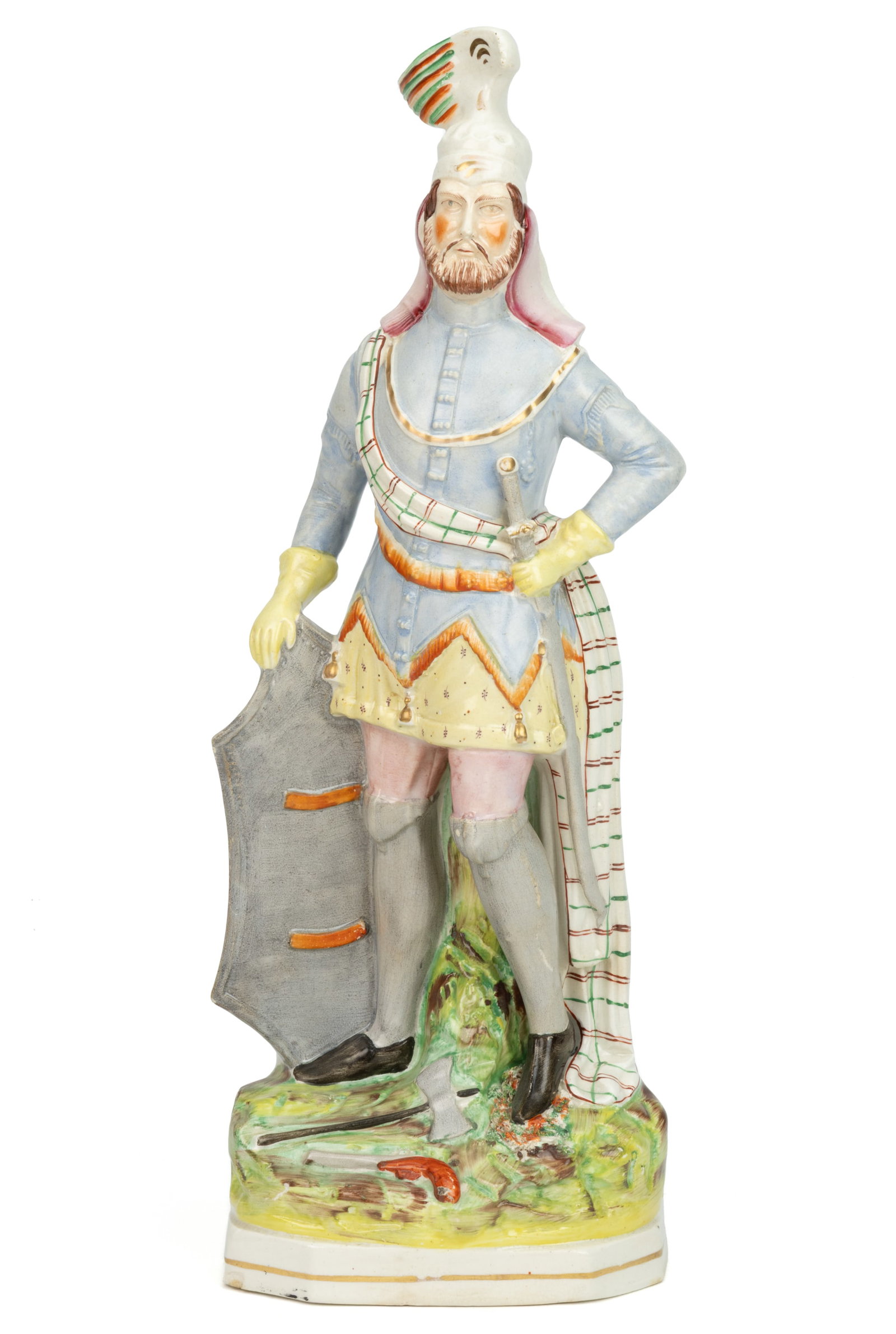 ENGLISH STAFFORDSHIRE HAND-PAINTED CERAMIC LARGE CRUSADER FIGURE: ENGLISH STAFFORDSHIRE HAND-PAINTED CERAMIC LARGE CRUSADER FIGURE, having colorful polychrome enamel decorations, depicting a bearded man wearing a feathered helmet, standing on a canted corner base, a