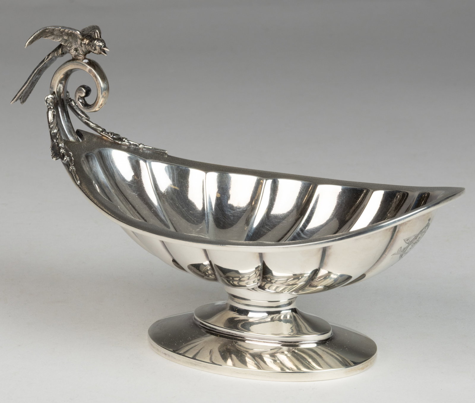 WOOD & HUGHES, NEW YORK CITY, NEW YORK BIRD FIGURAL 0.900 SILVER FOOTED DISH: WOOD & HUGHES, NEW YORK CITY, NEW YORK BIRD FIGURAL 0.900 SILVER FOOTED DISH, probably a nut dish or bon bon bowl, having an ovoid shell well with acid-etched rim, one end with a flying scroll han