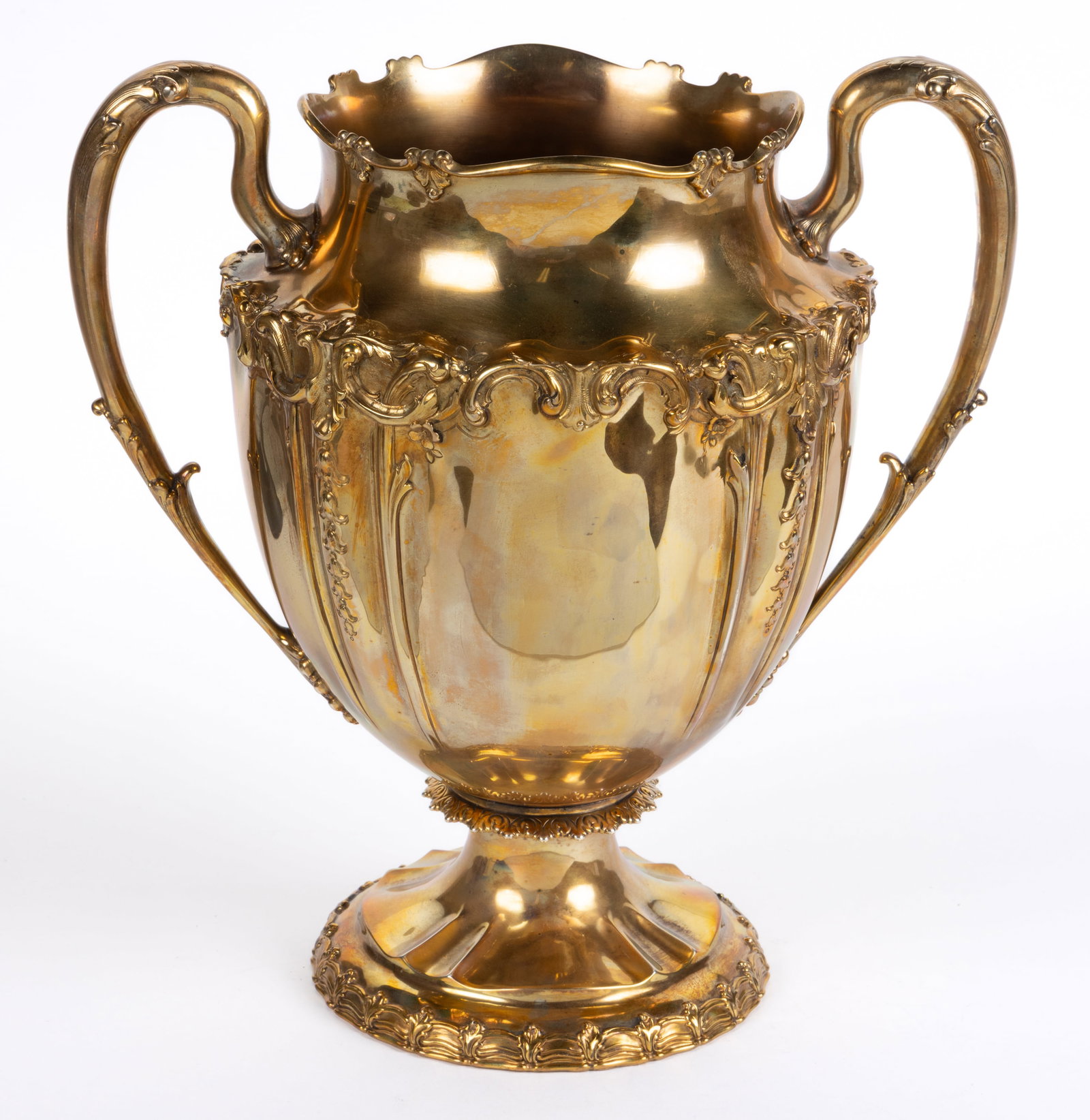 TIFFANY & CO. GILT STERLING SILVER GILT LARGE HANDLED VASE: TIFFANY & CO. GILT STERLING SILVER GILT LARGE HANDLED VASE, shoulder form with leaf-and-scroll rim, featuring repousse, chased, and engraved decoration of scrolls, flowers, and leaves, h