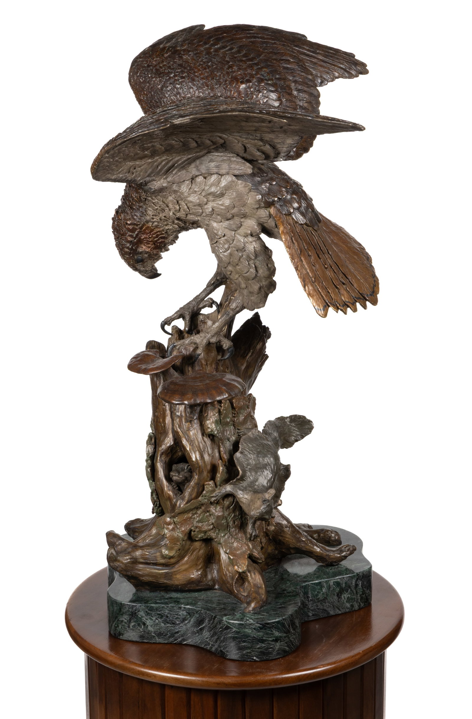 WILLIAM H. / DAVID H. TURNER (VIRGINIA, ACTIVE 20TH/21ST CENTURY) CAST-BRONZE SCULPTURE OF A HAWK: WILLIAM H. / DAVID H. TURNER (VIRGINIA, ACTIVE 20TH/21ST CENTURY) CAST-BRONZE SCULPTURE OF A HAWK WITH CUSTOM PEDESTAL, LOT OF TWO, cast-bronze with patinated surface, depicting a large hawk perched o