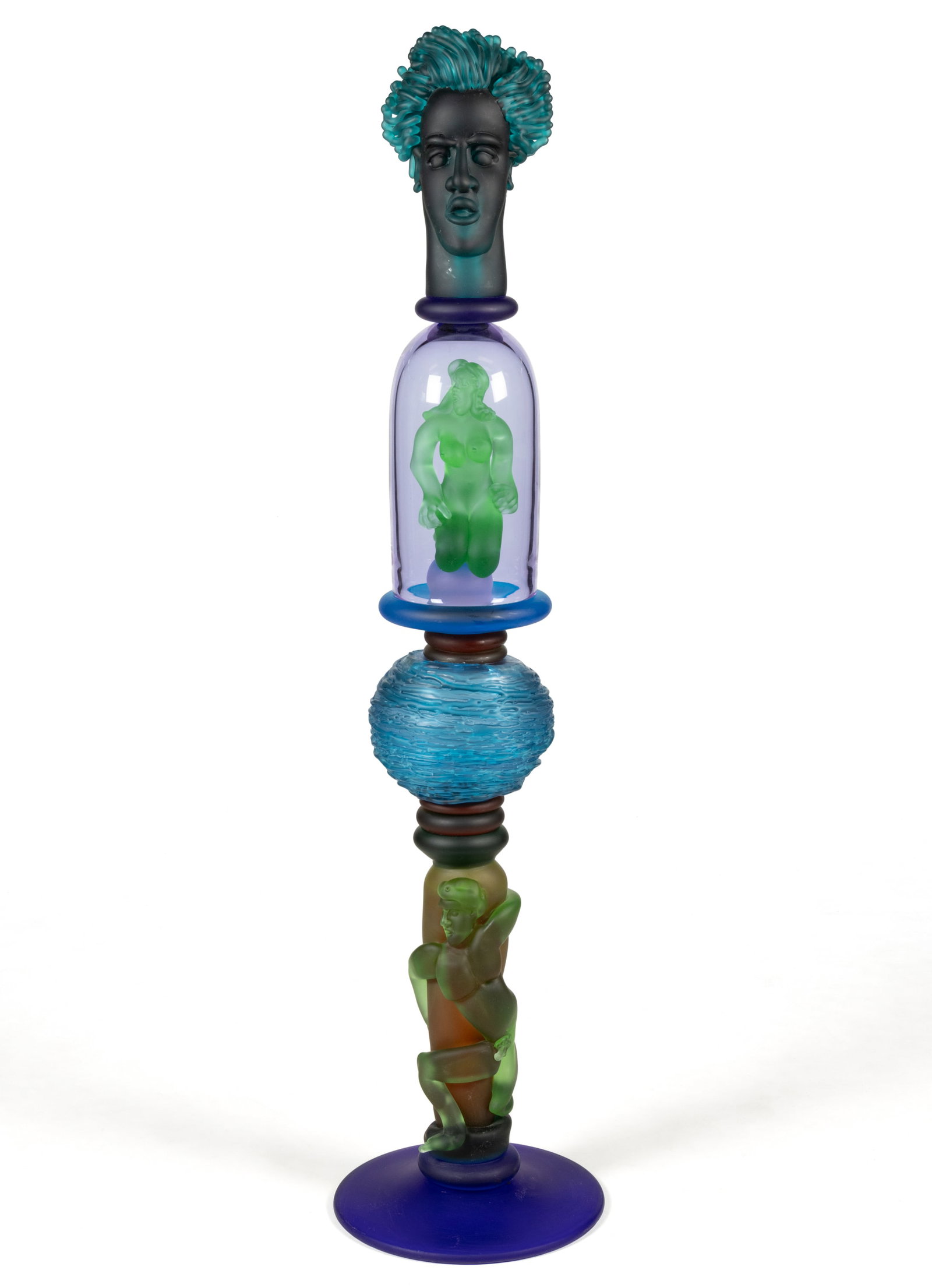 RICHARD JOLLEY (AMERICAN, B. 1952) ART GLASS TOTEM SCULPTURE: RICHARD JOLLEY (AMERICAN, B. 1952) ART GLASS TOTEM SCULPTURE, hand-blown, acid-etched and hot formed, depicting an opaque black male head with semi-translucent turquoise hair, atop a co