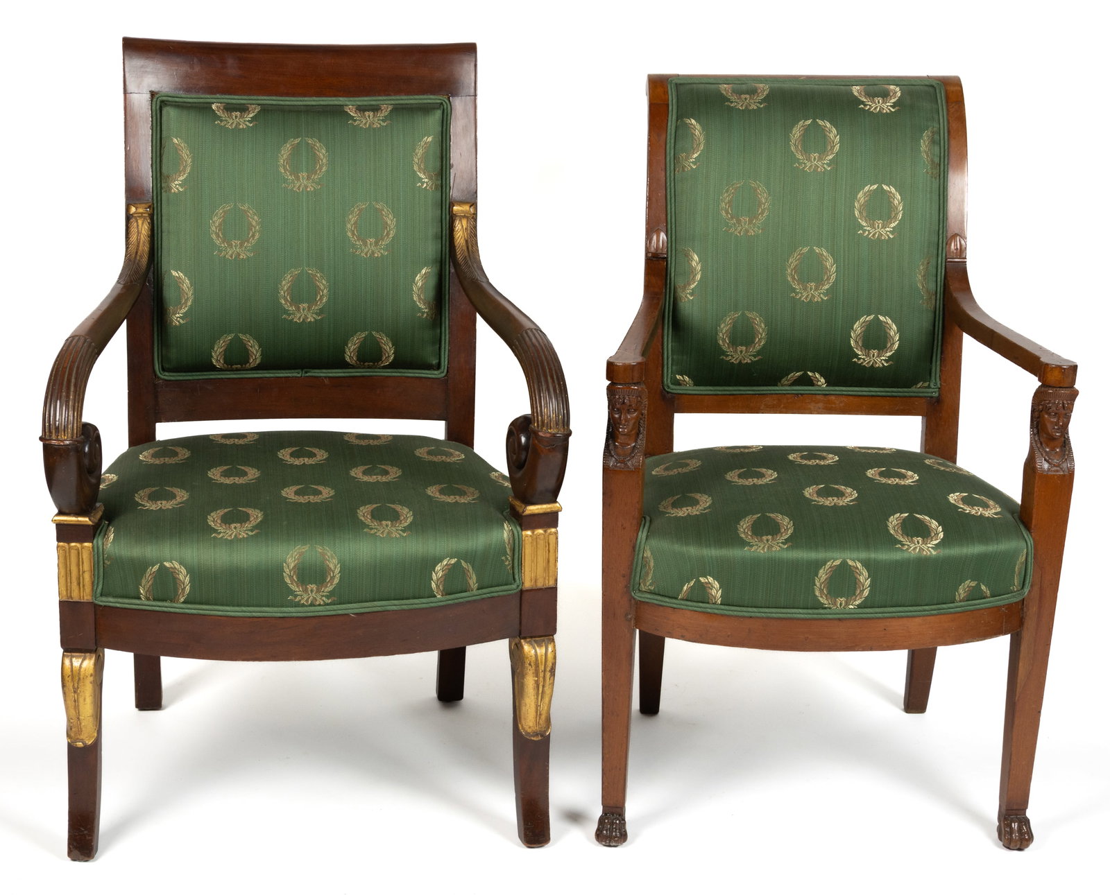 FRENCH EMPIRE CARVED MAHOGANY FAUTEILS / OPEN ARMCHAIRS, LOT OF TWO: FRENCH EMPIRE CARVED MAHOGANY FAUTEILS / OPEN ARMCHAIRS, LOT OF TWO, each upholstered in green silk, one featuring figural Egyptian head arm rest supports, the other with gilt highlights. Second quart