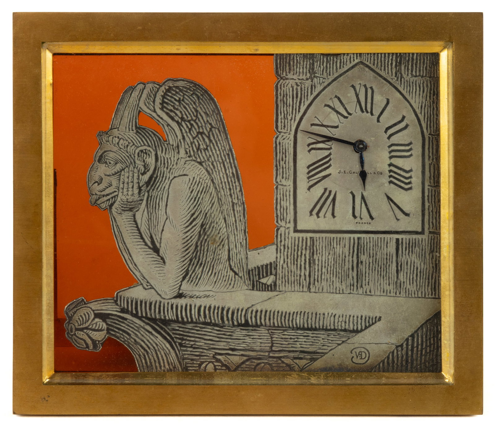 CHARLES HOUR, FRENCH GARGOYLE DESK CLOCK: CHARLES HOUR, FRENCH GARGOYLE DESK CLOCK, the gilt-brass frame with easel back housing an engraved silvered depiction of a gargoyle overlooking Paris from Notre Dame Cathedral, after the print "L