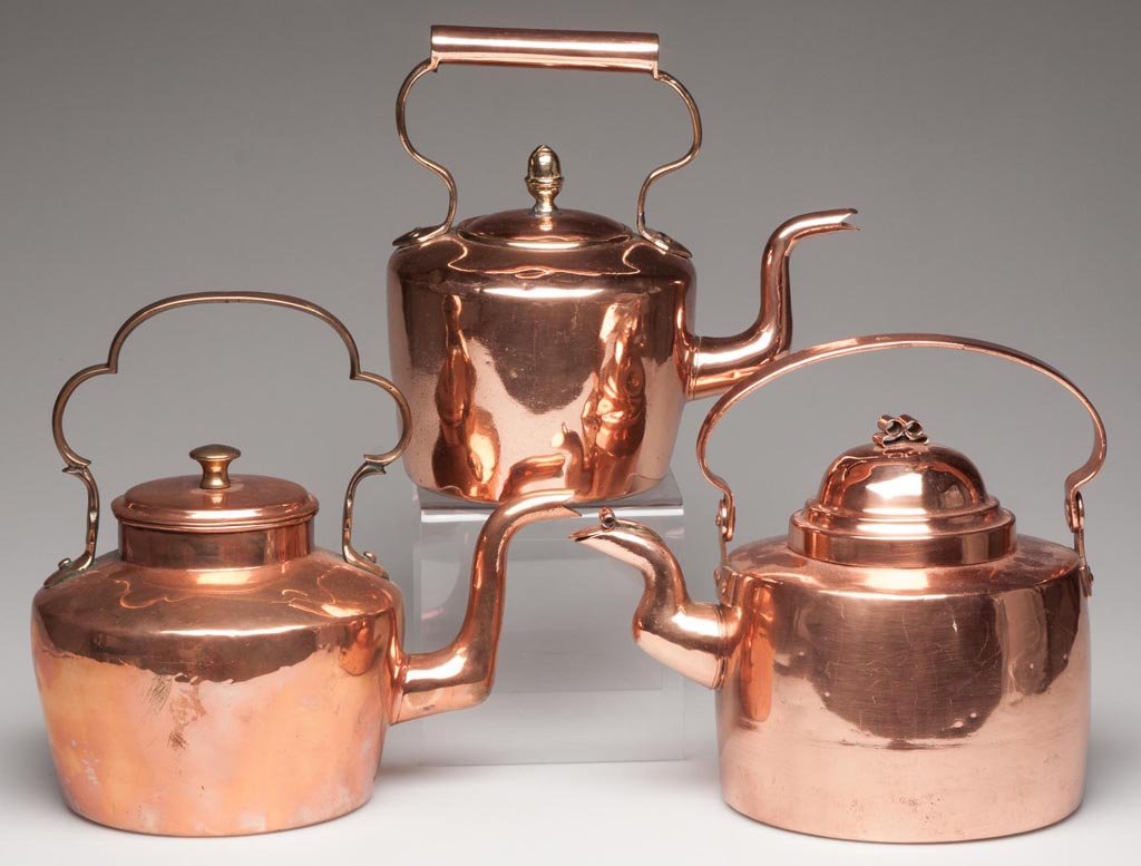 ASSORTED COPPER TEA KETTLES, LOT OF THREE: ASSORTED COPPER TEA KETTLES, LOT OF THREE, each circular dovetailed body with a gooseneck spout, one with spout flap and swinging handle, others with fixed handles. 19th century. 8 3/4" to 9 1/2" HOA.