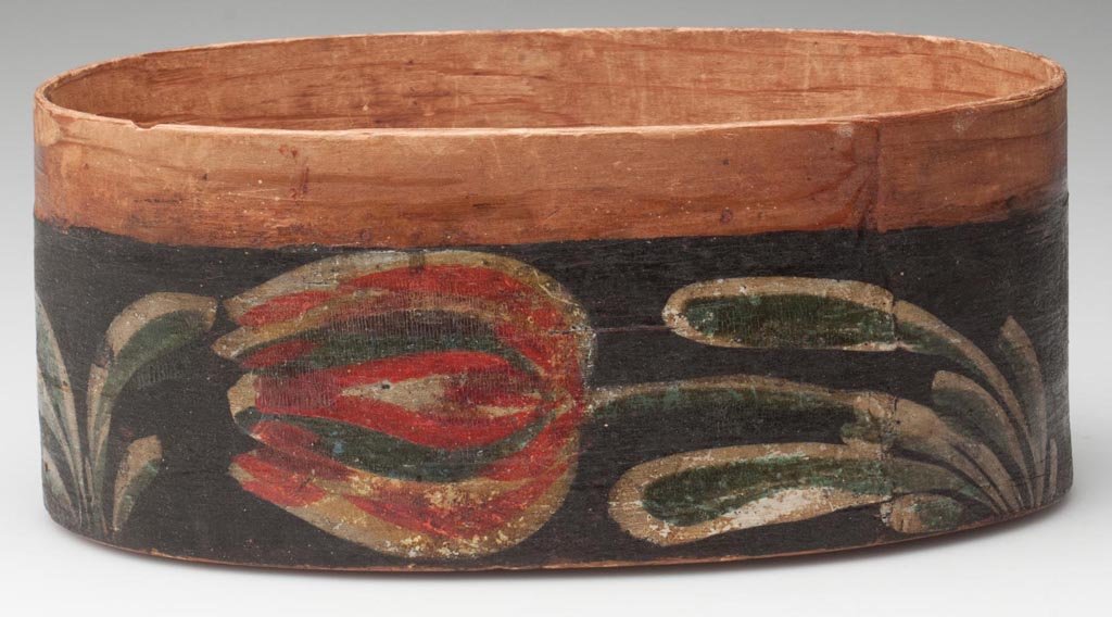 PENNSYLVANIA ATTRIBUTED PAINTED PINE BENTWOOD BOX: PENNSYLVANIA ATTRIBUTED PAINTED PINE BENTWOOD BOX, decorated with a polychrome tulip on each side, lacking lid. Excellent original dry surface. Attributed to Heinrich Bucher, Berks Co., Pennsylvania. 