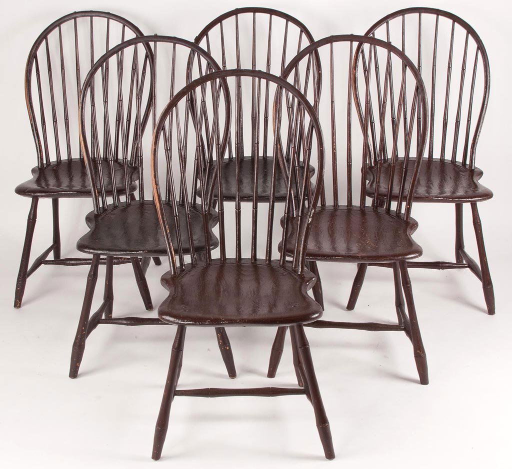 AMERICAN BOW-BACK WINDSOR SIDE CHAIRS, MATCHING SET OF: AMERICAN BOW-BACK WINDSOR SIDE CHAIRS, MATCHING SET OF SIX, each featuring a nine-spindle back above a well-shaped seat and bamboo-turned legs. Older brown-painted or dark varnished surfaces. Late 18t