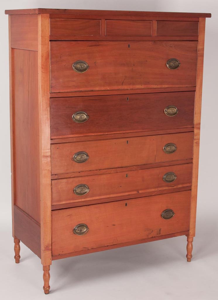 PENNSYLVANIA SHERATON CHERRY HIGH CHEST: PENNSYLVANIA SHERATON CHERRY HIGH CHEST, top with applied reeded moldings above three-over-five drawers, each with applied cock beading, and fielded-panel ends, the whole raised on turned feet. Poplar