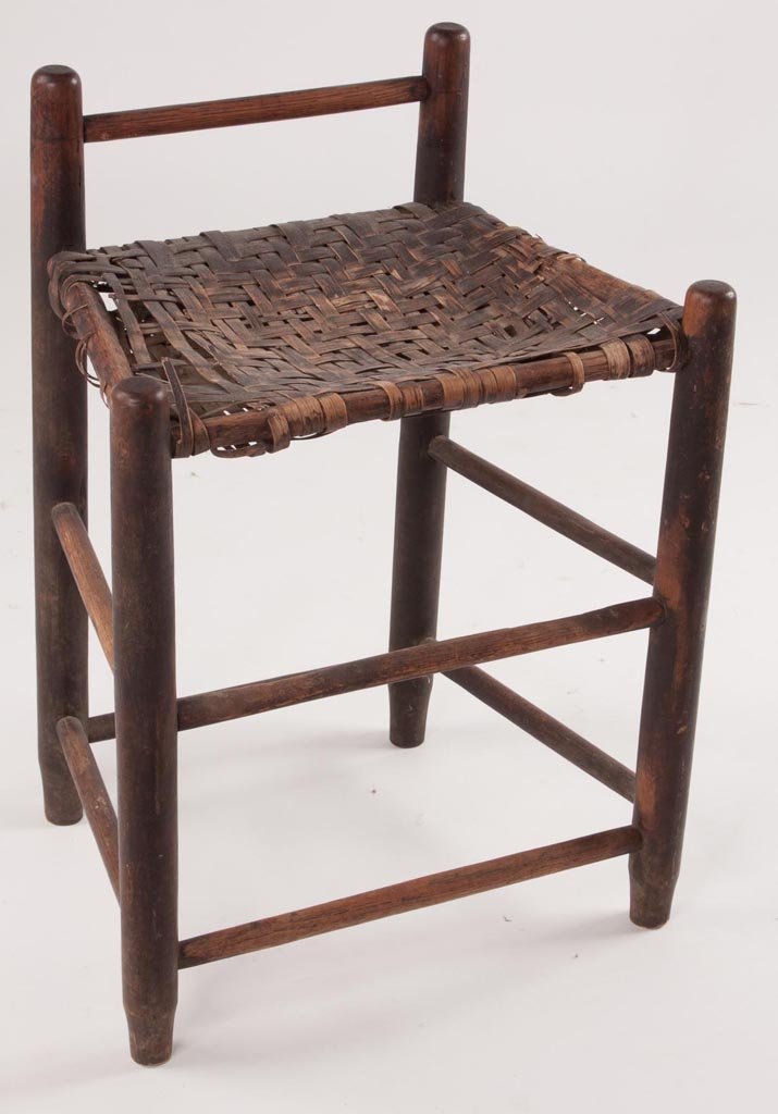 NORTH CAROLINA TURNED WEAVER'S STOOL: NORTH CAROLINA TURNED WEAVER'S STOOL, poplar and hickory or white oak, low single-rail back above the original woven white-oak splint seat. Original surface with outstanding patina. Probably Moravian,
