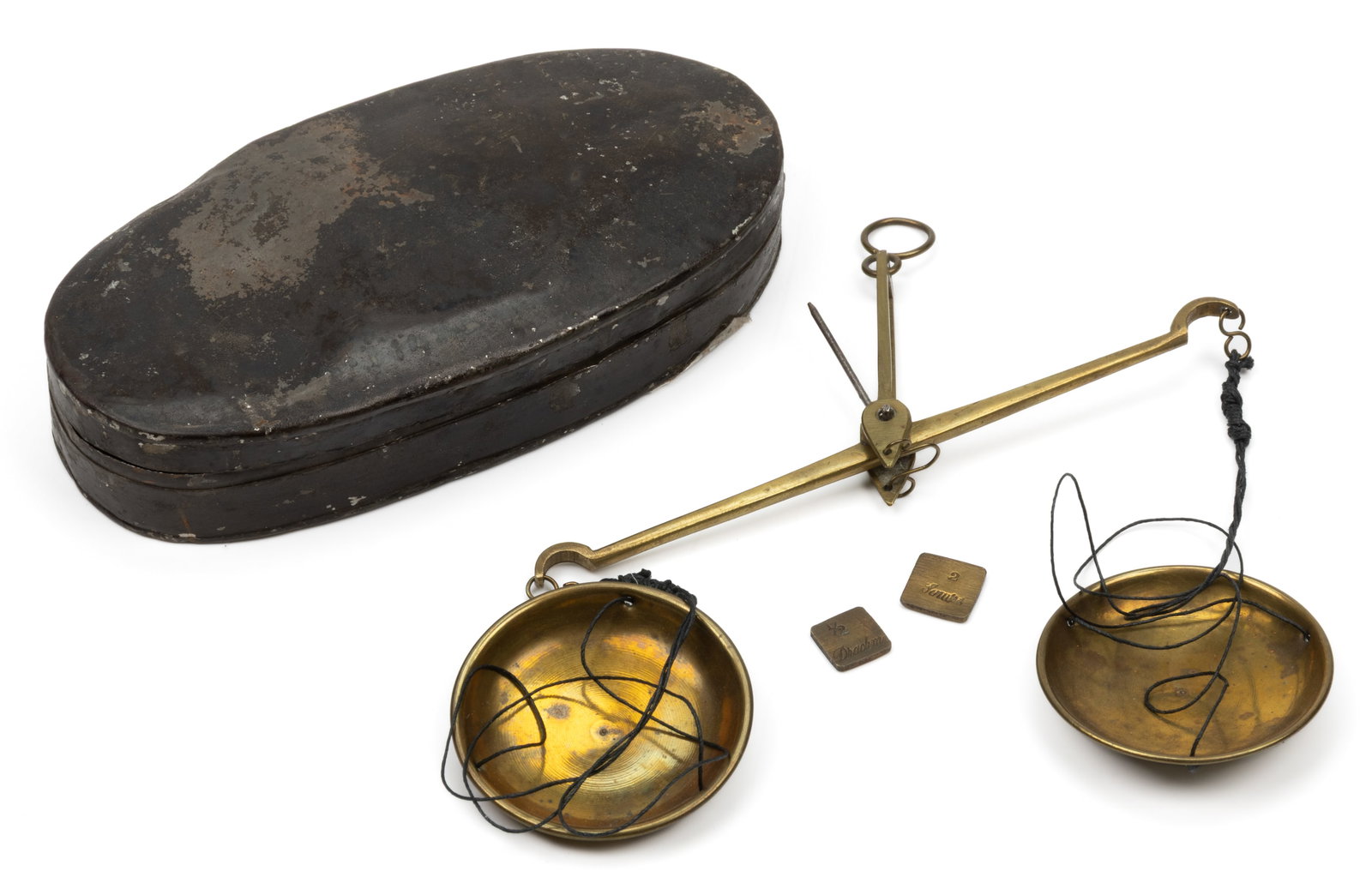 VIRGINIA DOCTOR'S GOLD-COIN BRASS BALANCE SCALES: VIRGINIA DOCTOR'S GOLD-COIN BRASS BALANCE SCALES, the bar retaining its original pointer, two pans attached with strings, and two weights, housed in its original japanned sheet-iron/tin hinged-lid