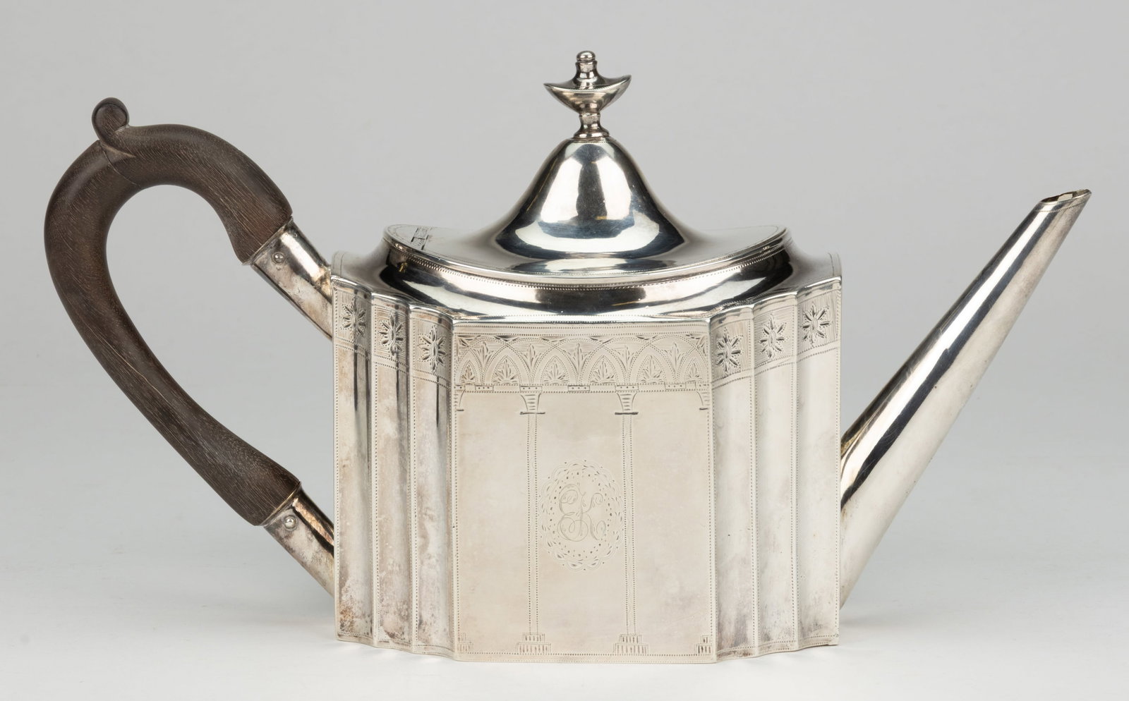 AMERICAN ENGRAVED-DECORATED COIN SILVER TEAPOT: AMERICAN ENGRAVED-DECORATED COIN SILVER TEAPOT, Neoclassical-style, elongated octagonal form with scalloped corners, having bright-cut engraved decoration featuring columns, arches, and rosettes, two 