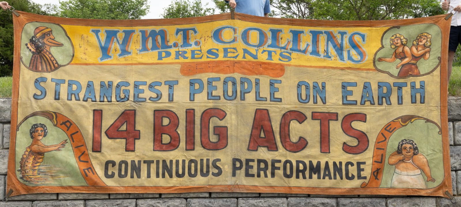 GEORGE BELLIS (AMERICAN, 1865-1956), ATTRIBUTED, SUNSHINE STUDIO PAINTED CIRCUS / AMUSEMENT: GEORGE BELLIS (AMERICAN, 1865-1956), ATTRIBUTED, SUNSHINE STUDIO PAINTED CIRCUS / AMUSEMENT MONUMENTAL SIDESHOW BANNER, rectangular form, paint on canvas, orange border over text "W. M. T. C