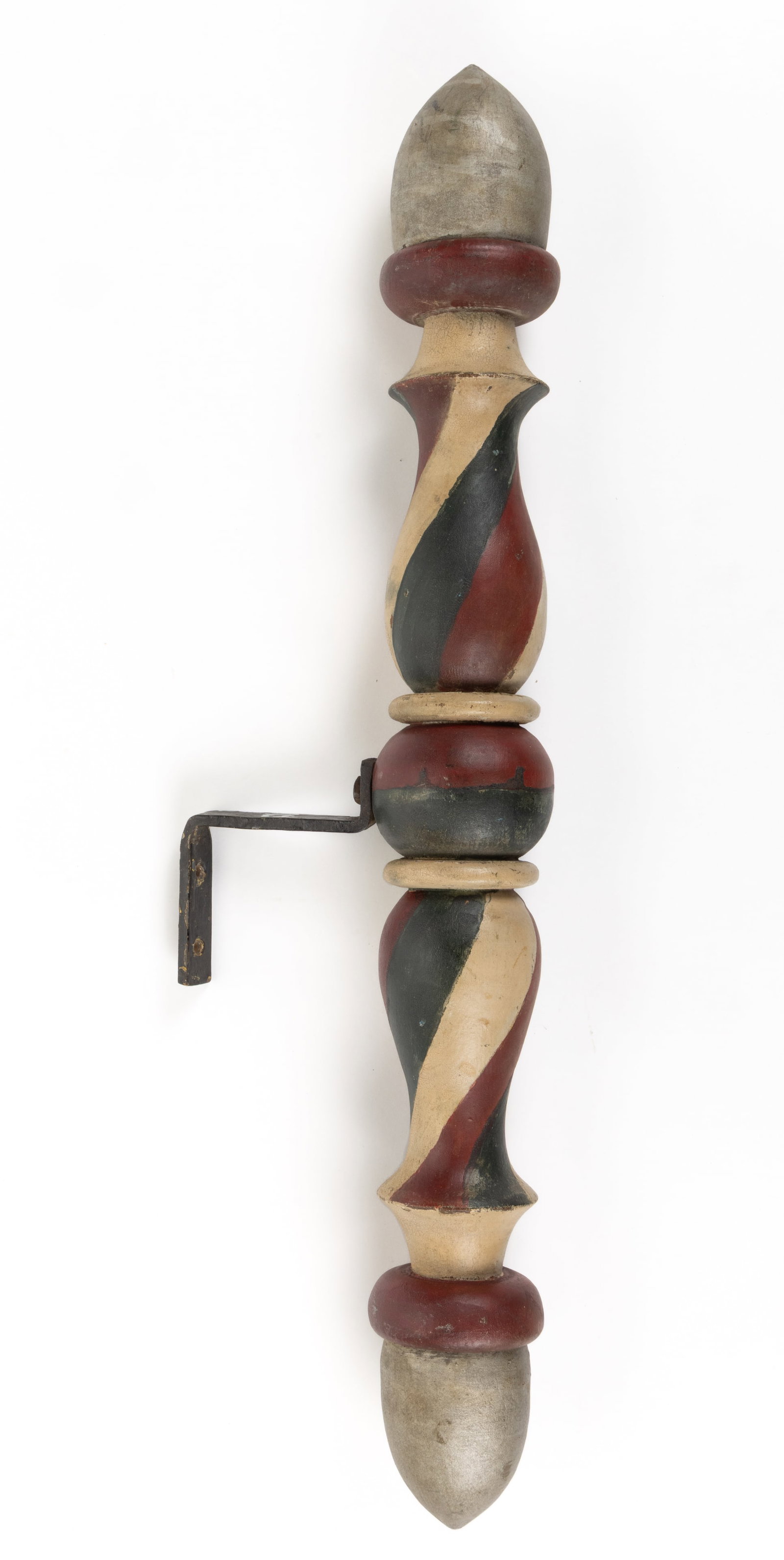AMERICAN FOLK ART TURNED AND PAINTED WOODEN BARBER POLE: AMERICAN FOLK ART TURNED AND PAINTED WOODEN BARBER POLE, a diminutive wall-mounted example fitted with iron bracket, retaining possibly original surface in red, white, blue, and silver. Late 19th/earl