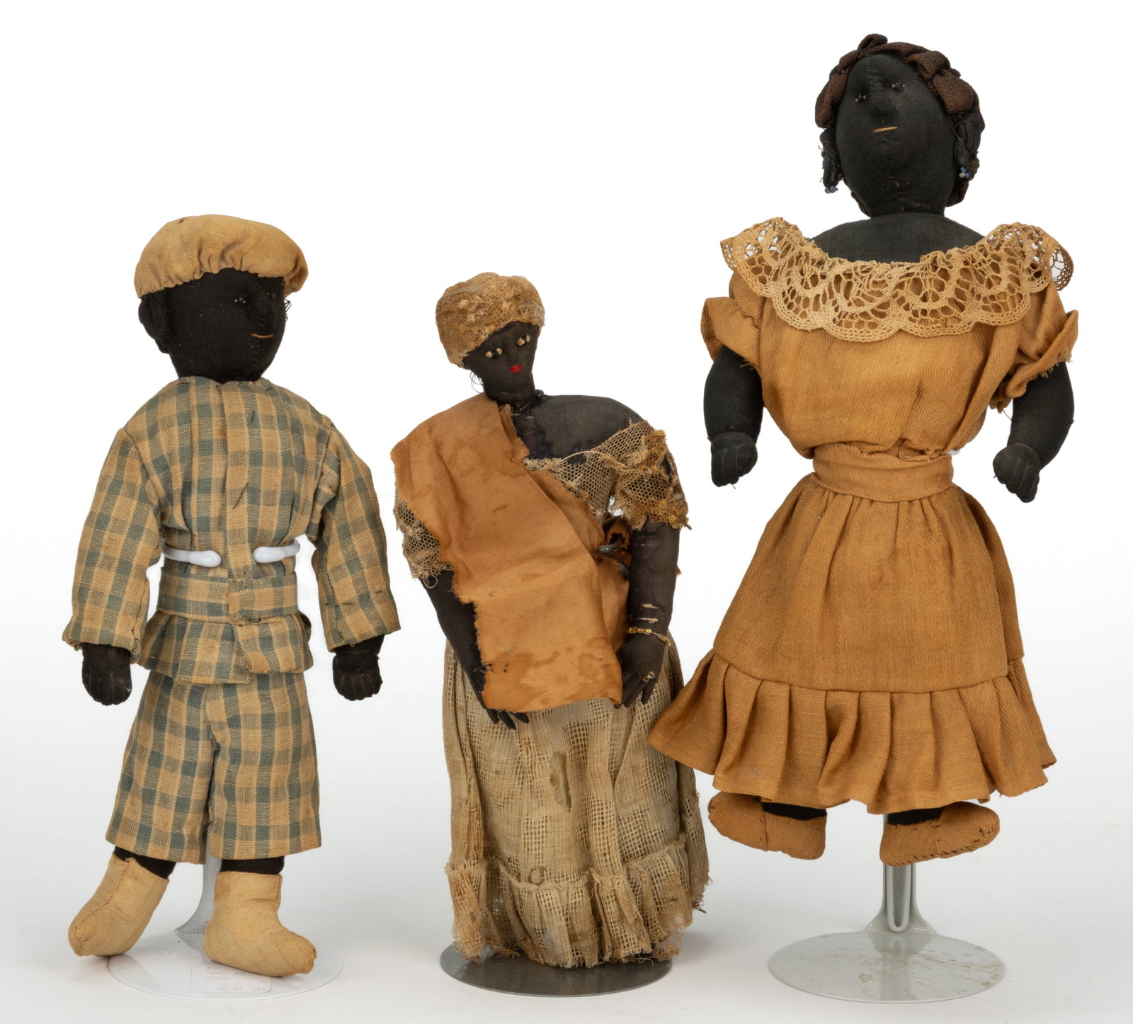 ROANOKE, VALLEY OF VIRGINIA FOLK ART CLOTH / RAG BLACK AMERICANA DOLLS, LOT OF THREE: ROANOKE, VALLEY OF VIRGINIA FOLK ART CLOTH / RAG BLACK AMERICANA DOLLS, LOT OF THREE, comprising two females and a male example, each with cloth/cotton stuffed bodies; each having sewn facial features