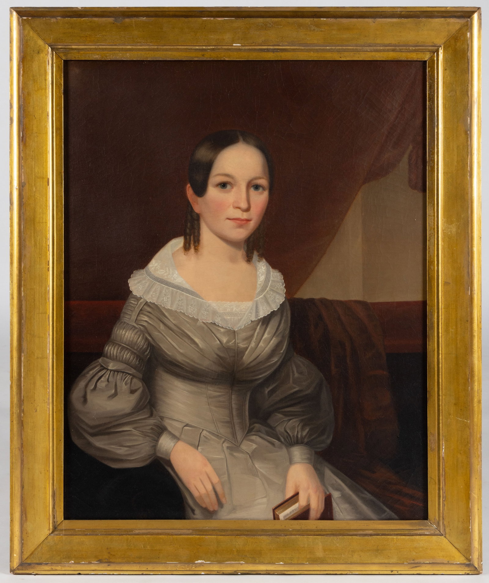 AMERICAN SCHOOL (19TH CENTURY) PORTRAIT OF A YOUNG LADY: AMERICAN SCHOOL (19TH CENTURY) PORTRAIT OF A YOUNG LADY, oil on canvas, a very fine rendition of a beautiful sitter in an Empire-style gown with white lace collar and organdy-type sleeves seated on a 